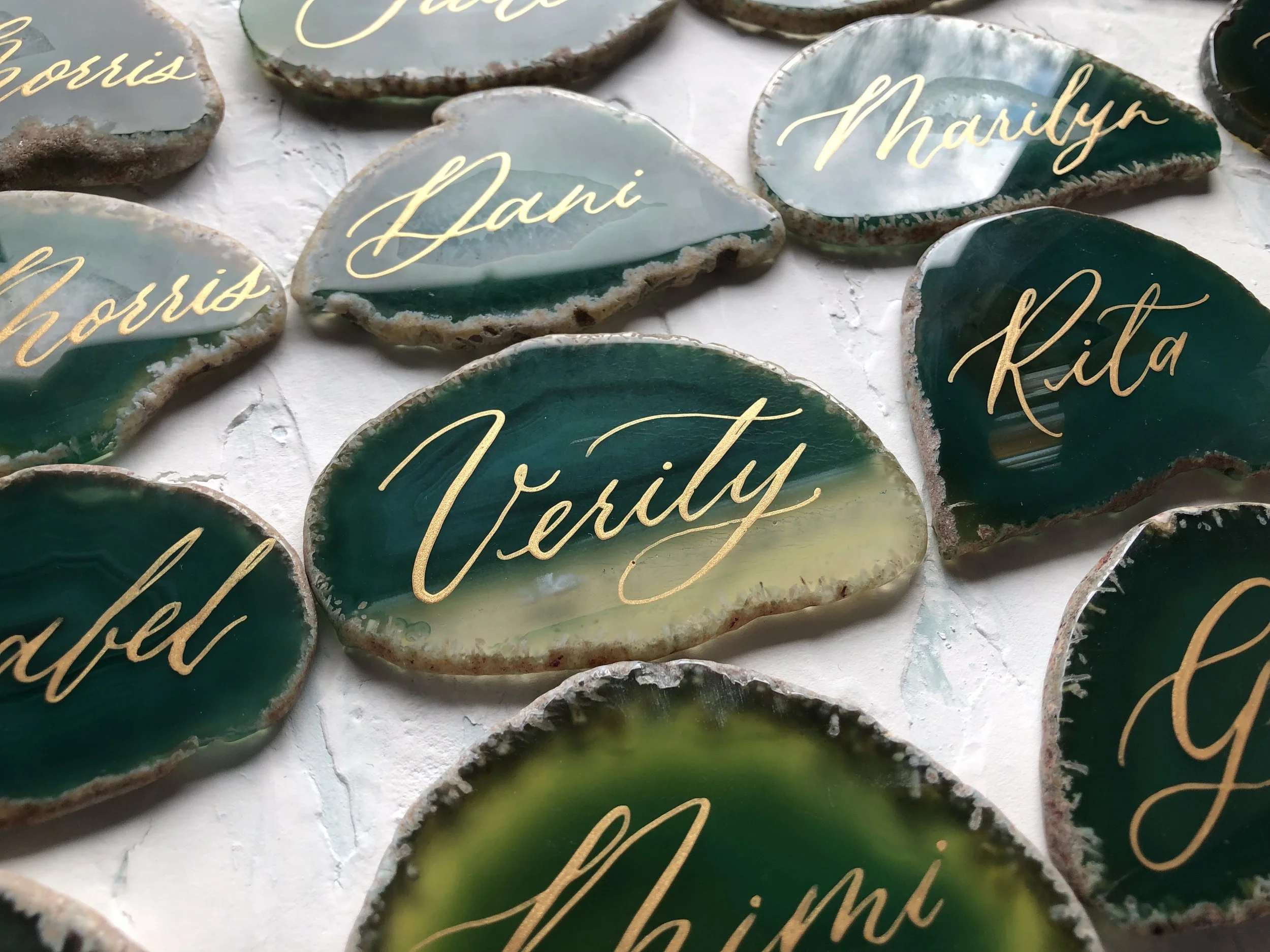 Green agate with gold handwriting