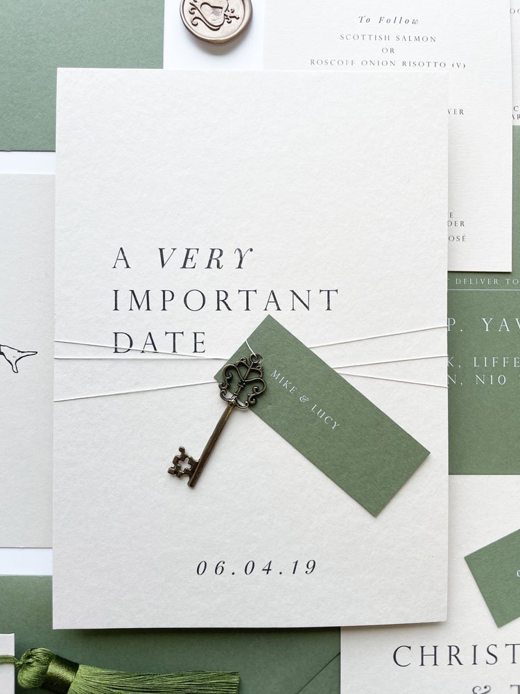 Aynhoe park wedding invitation with guest name tag and key