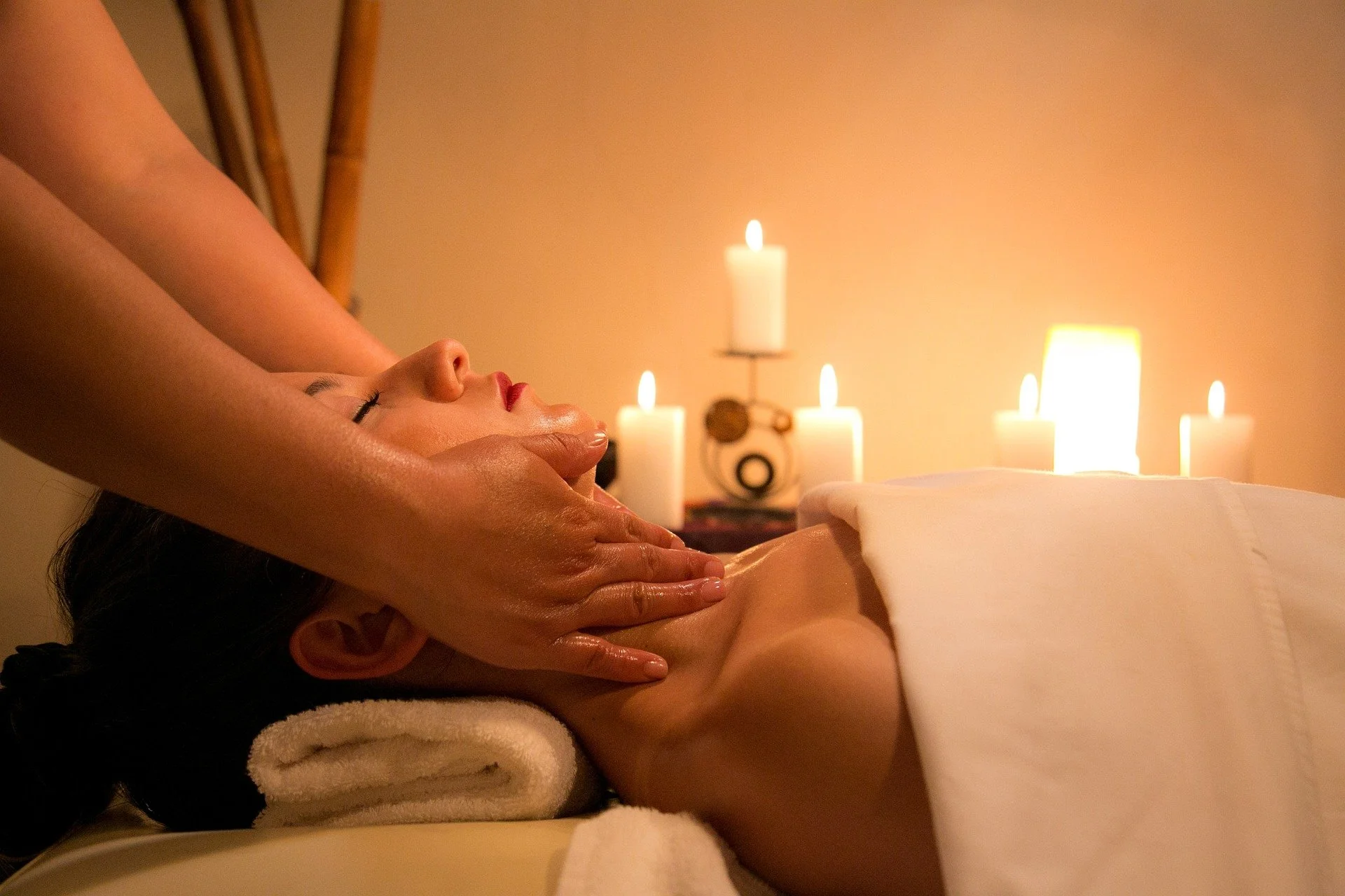 Person having massage with candles in background.jpg