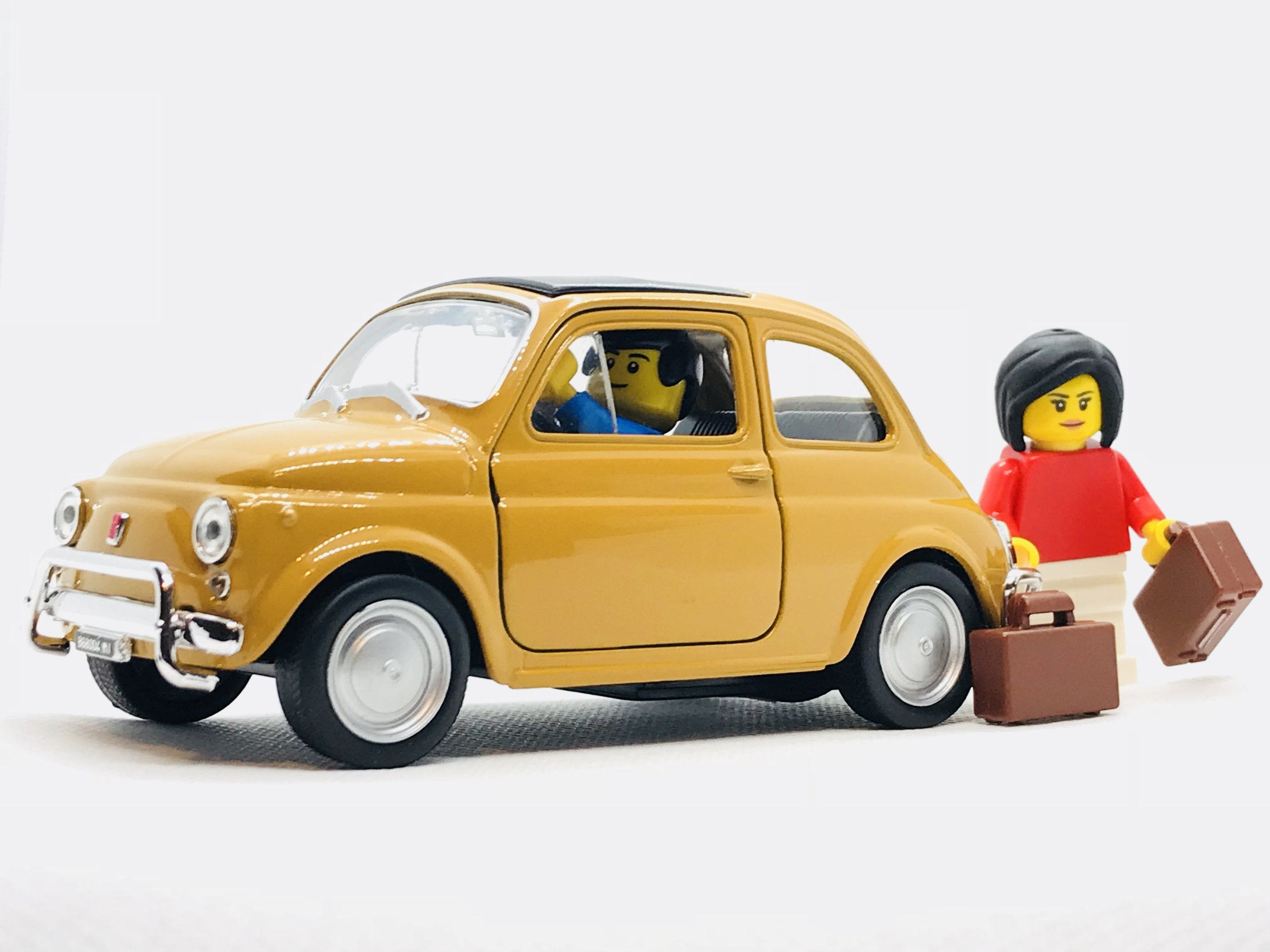 Lego couple and orange car