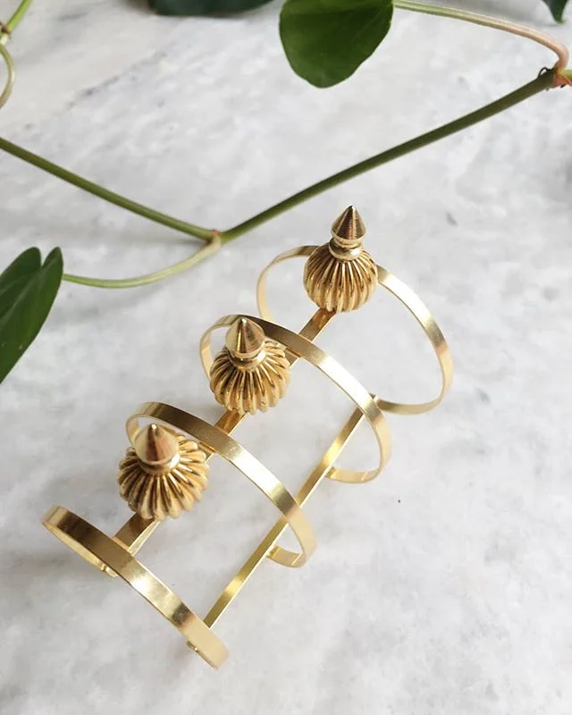 NEWNESS ALERT: A large bracelet is the perfect accessory to accentuate any outfit! Our large golden cuff bracelet has detailed cones that will make for an eye-catching statement piece.❤❤❤ #elegant #fashionjewellery #costumejewellery #newyeialert #new