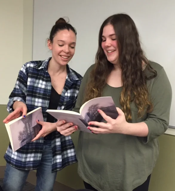 Students from the Women Poets class with books signed by Saskia Hamilton, February 2017