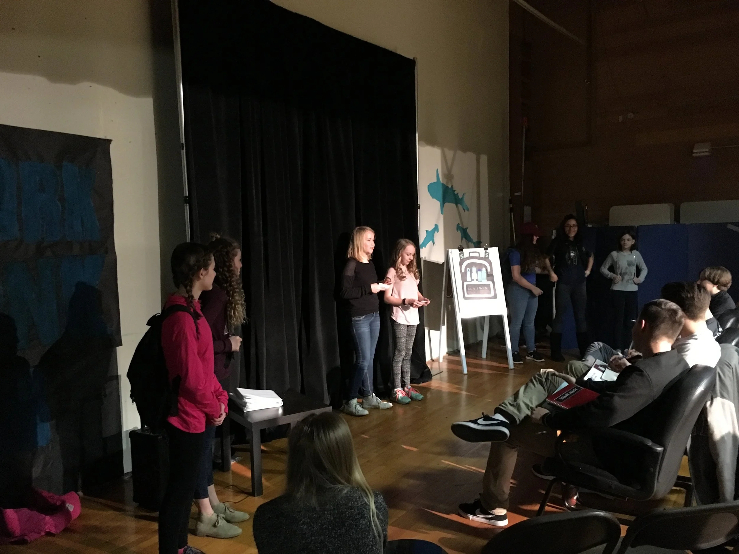 Spotlight on, models for their product, the Sharks listening intently....Lights, Camera, Action!