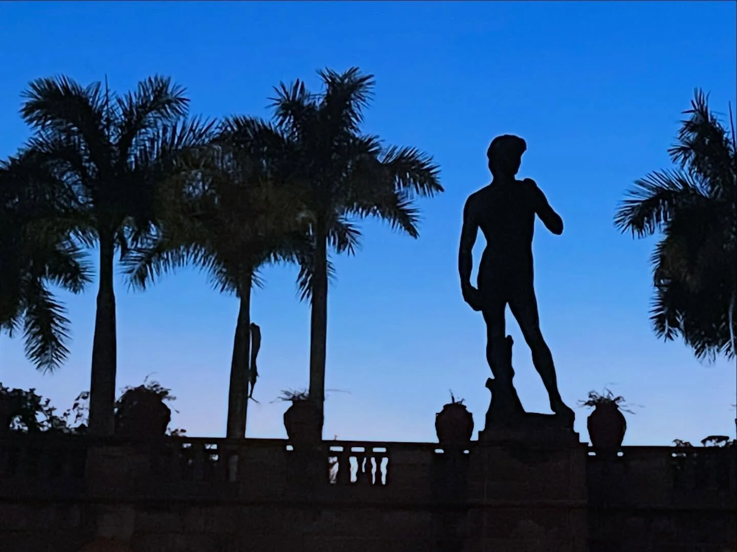I love twilight at @theringling with the sculpture and palms against the sky and Sarasota Bay. #twilight #sarasotasunset #floridaphotos