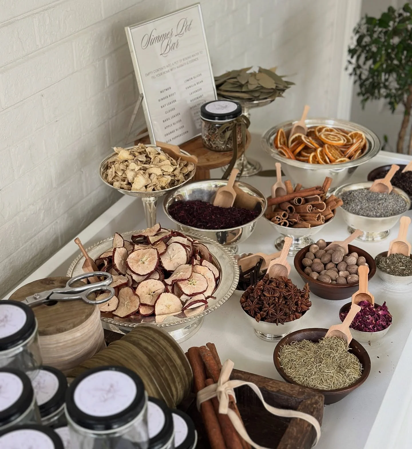 simmer bar for a seasonal activation…we set out customized empty jars with several bowls of dried fruit, herbs and spices for guests to create their own simmer pot blend. a gorgeous vignette turns into a valued takeaway for guests to use to br