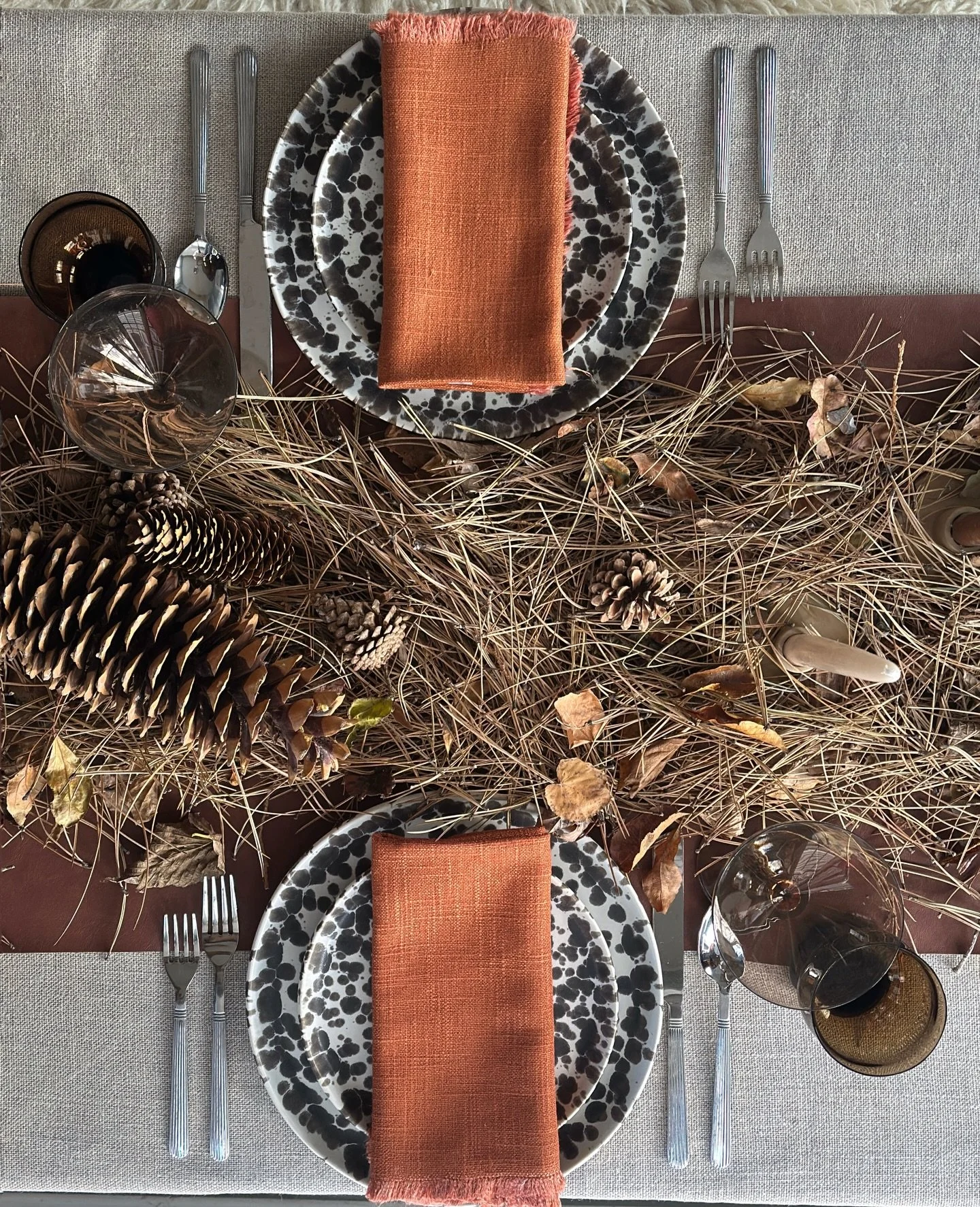 there were just two, and i&rsquo;m always attracted to an organic tablescape. i found these pine needles in our back parking lot and they became a messy, textural layer on top of the leather runner. a reminder that sometimes when life is chaotic, the