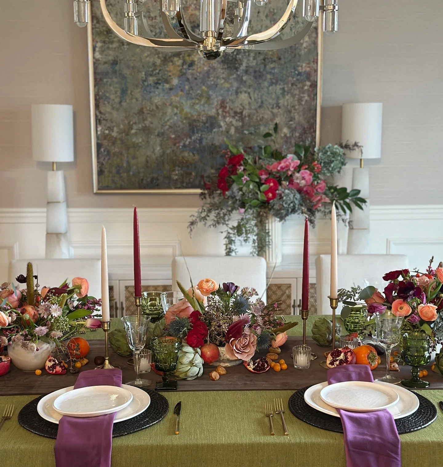 jewel toned and fruitful Thanksgiving table. we leaned into bold colors and lush florals with artichokes, pomegranate, dates and golden berries as accents with gold flatware and candlesticks. LOVED this colorful and strong palette. we&rsquo;ve been s