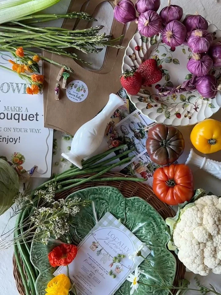 &ldquo;locally grown&rdquo; farmers market themed baby shower. we used bushels of fresh produce on the tabletop and vignettes. vintage plates and cabbage chargers dressed the mix and match tablescape to look effortless and charming. we displayed our 
