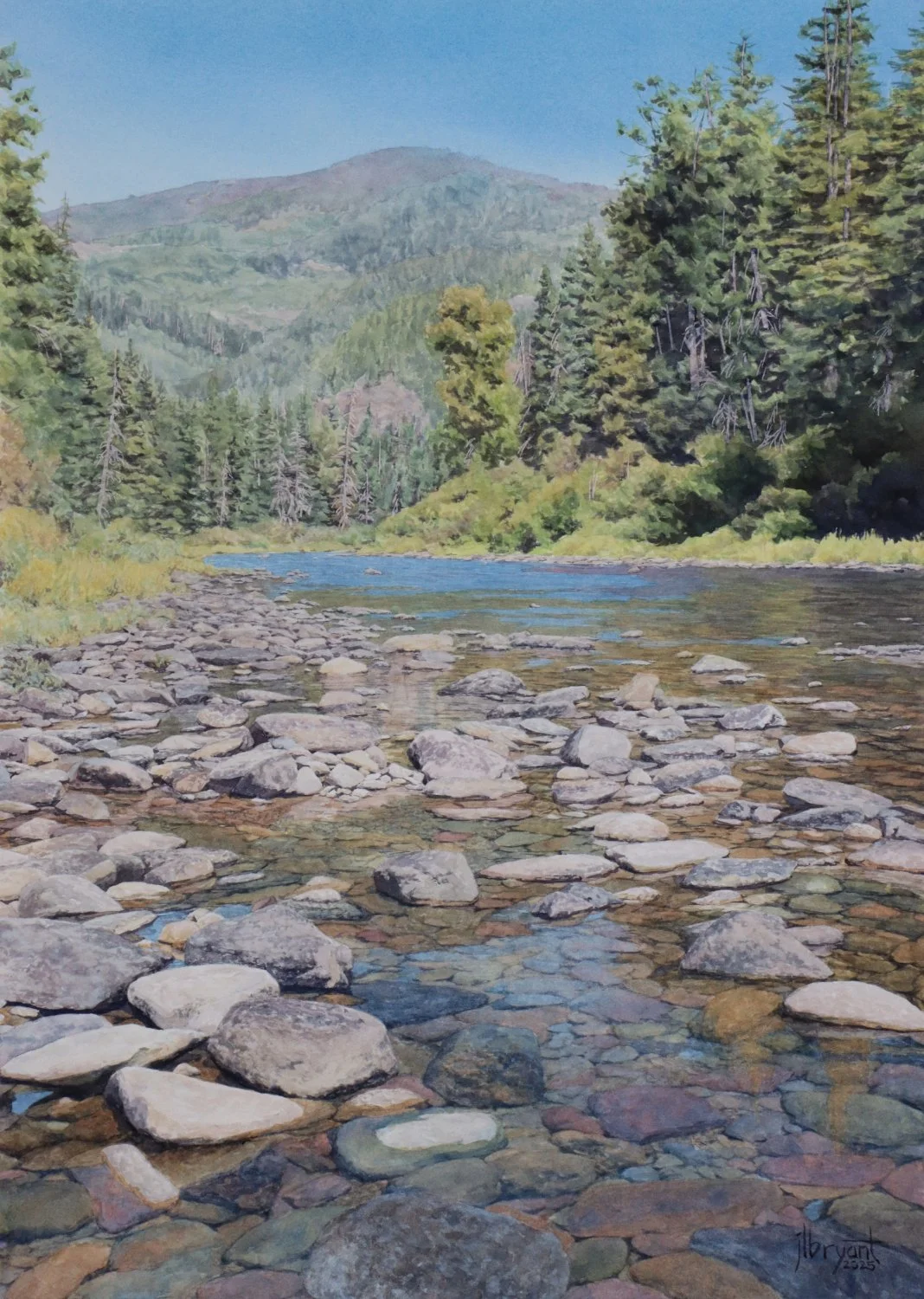 Watercolor painting of Coeur d'Alene River with rocks, trees, and distant mountain