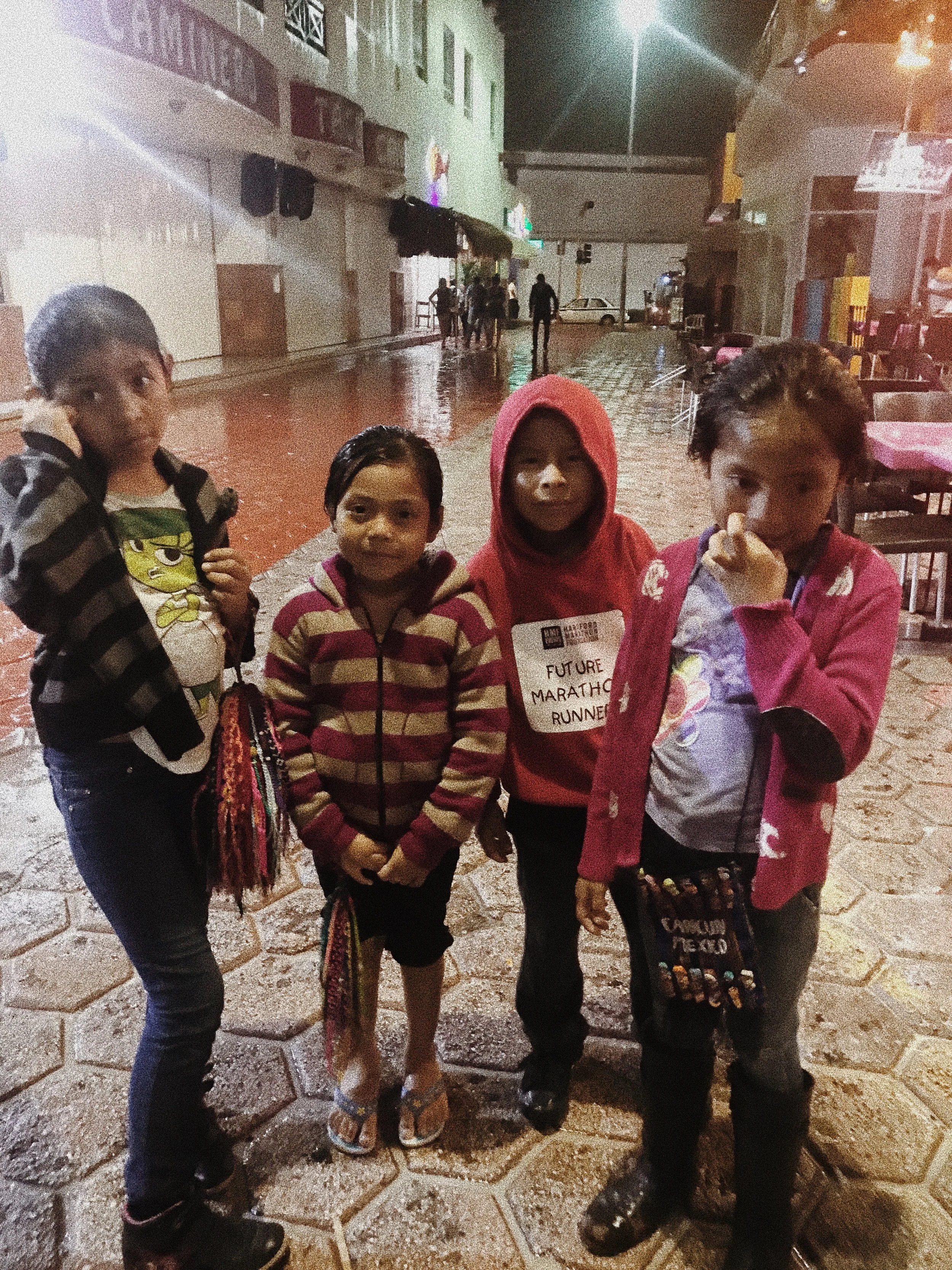 We decided to hit the town during the nights to experience the night life. All around were pretty lights, tourists dancing to the upbeat music, and families trying to sell what they could for money. We met these young kids in the valley on our way to a taxi. Their mom sends them out to sell bracelets. 