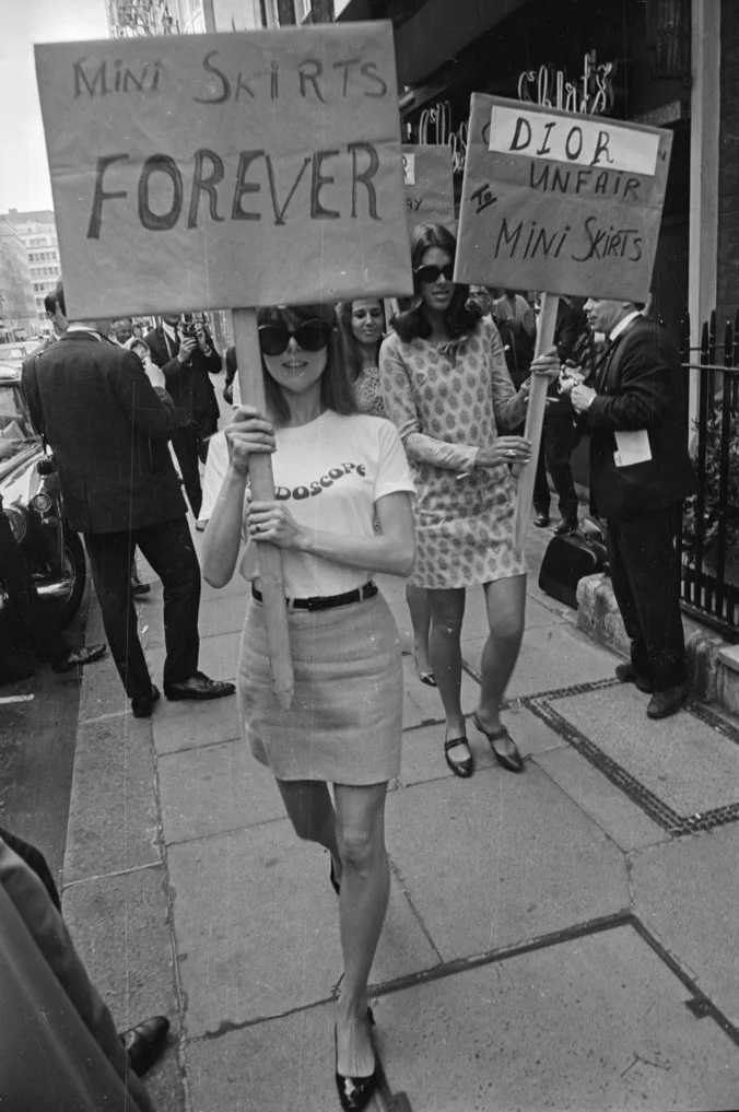 Women protesting in Great Britten, in order to protect the mini skirt, outside the House of Dior in 1966, for its 'unfair' treatment of mini skirts. By Larry Ellis