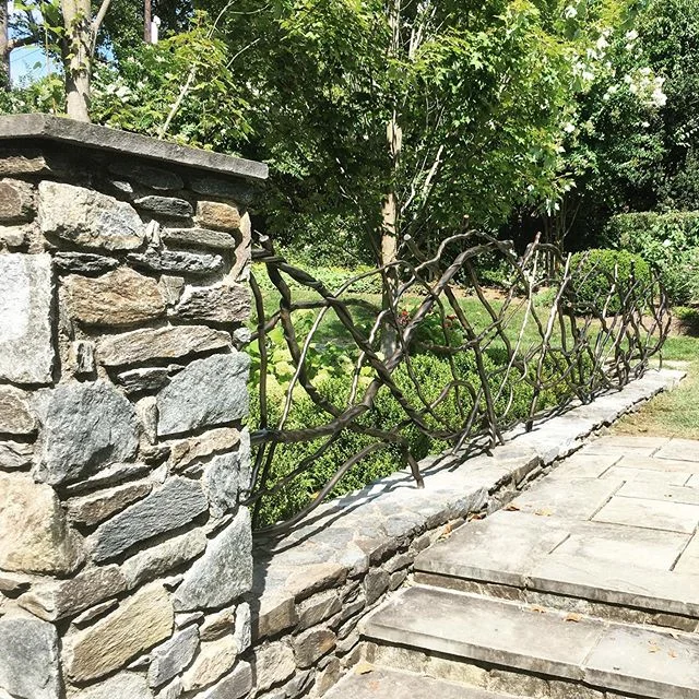 Our blackened stainless steel garden partition blends into this beautiful backyard in Potomac. A good late-summer build buttoned up last week #installation #stainlesssteel