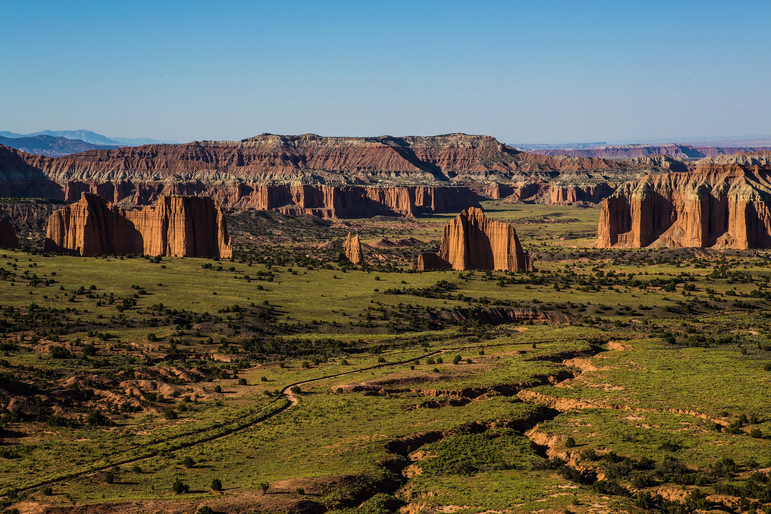 The view overlooking Cathedral Valley at sunset. That is an amazing little dirt track through the heart of the valley.