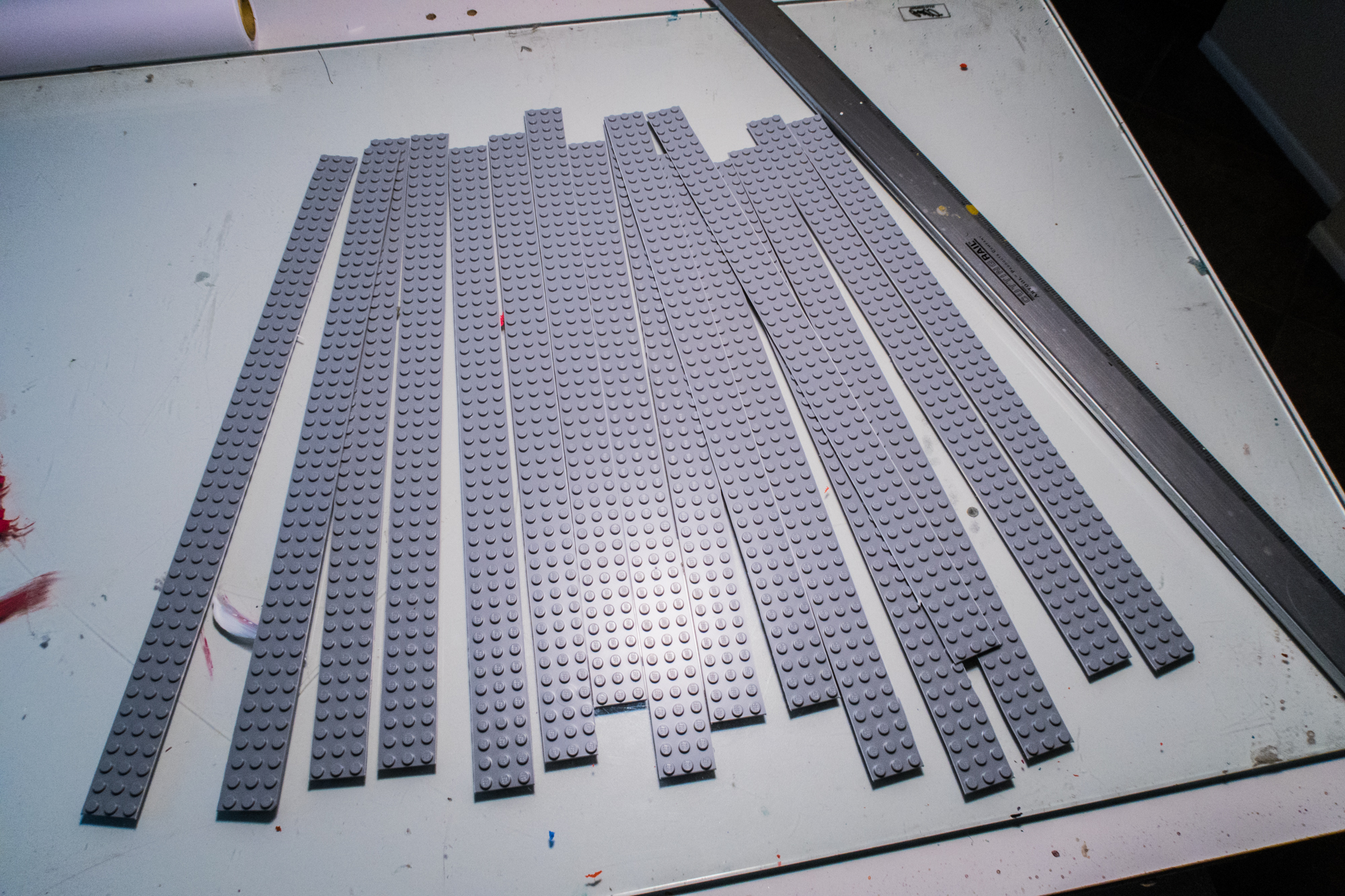 One large grey base plate made enough strips to cover two of the riser units, plus a number of left over strips that I used to make one big bottom plate from 6x8 plates.
