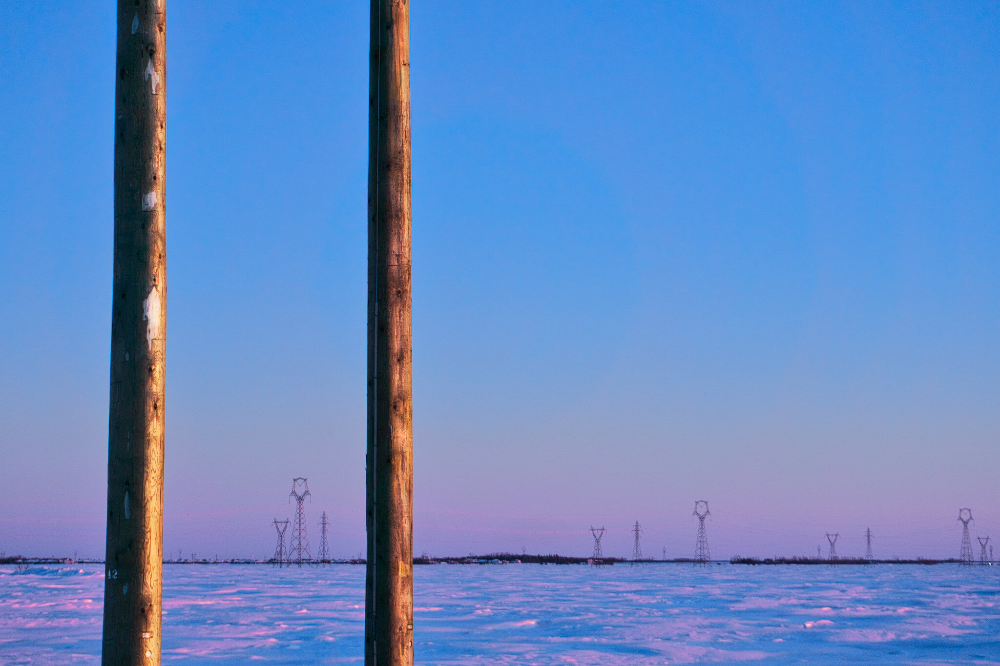 two poles with sunset