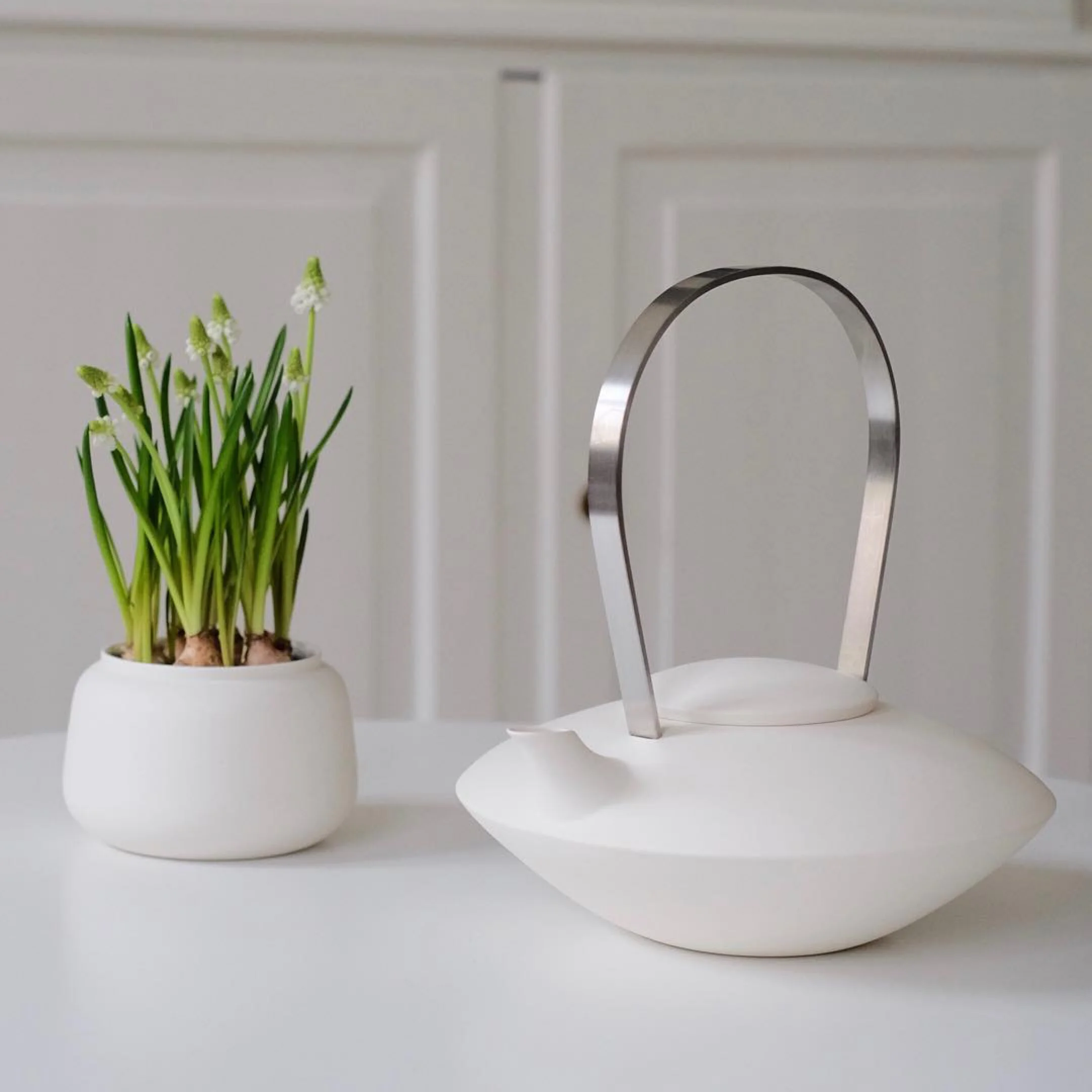 White ceramic pot for small plant by Ditte Fischer Copenhagen