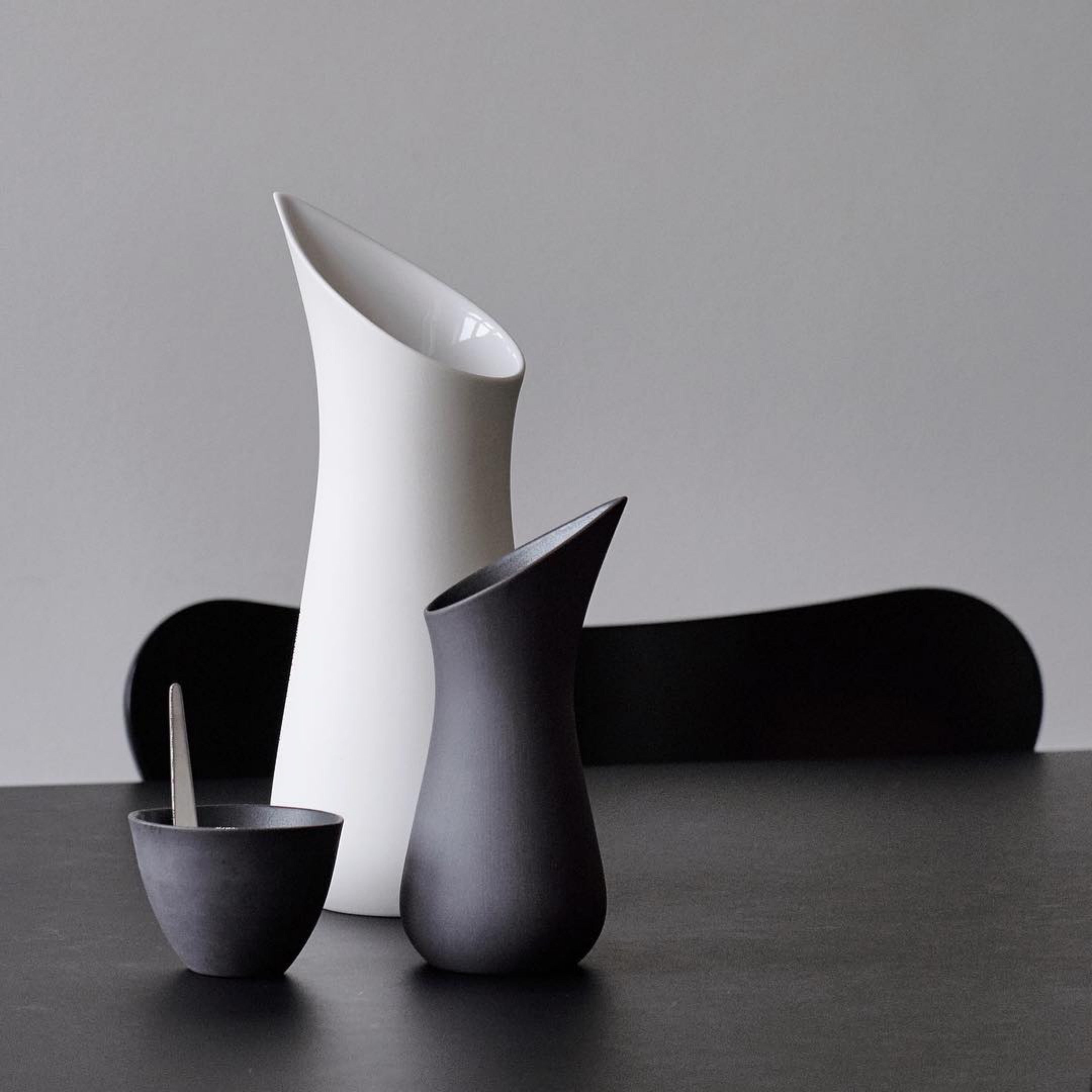 Handmade Scandinavian minimalist tableware on black table