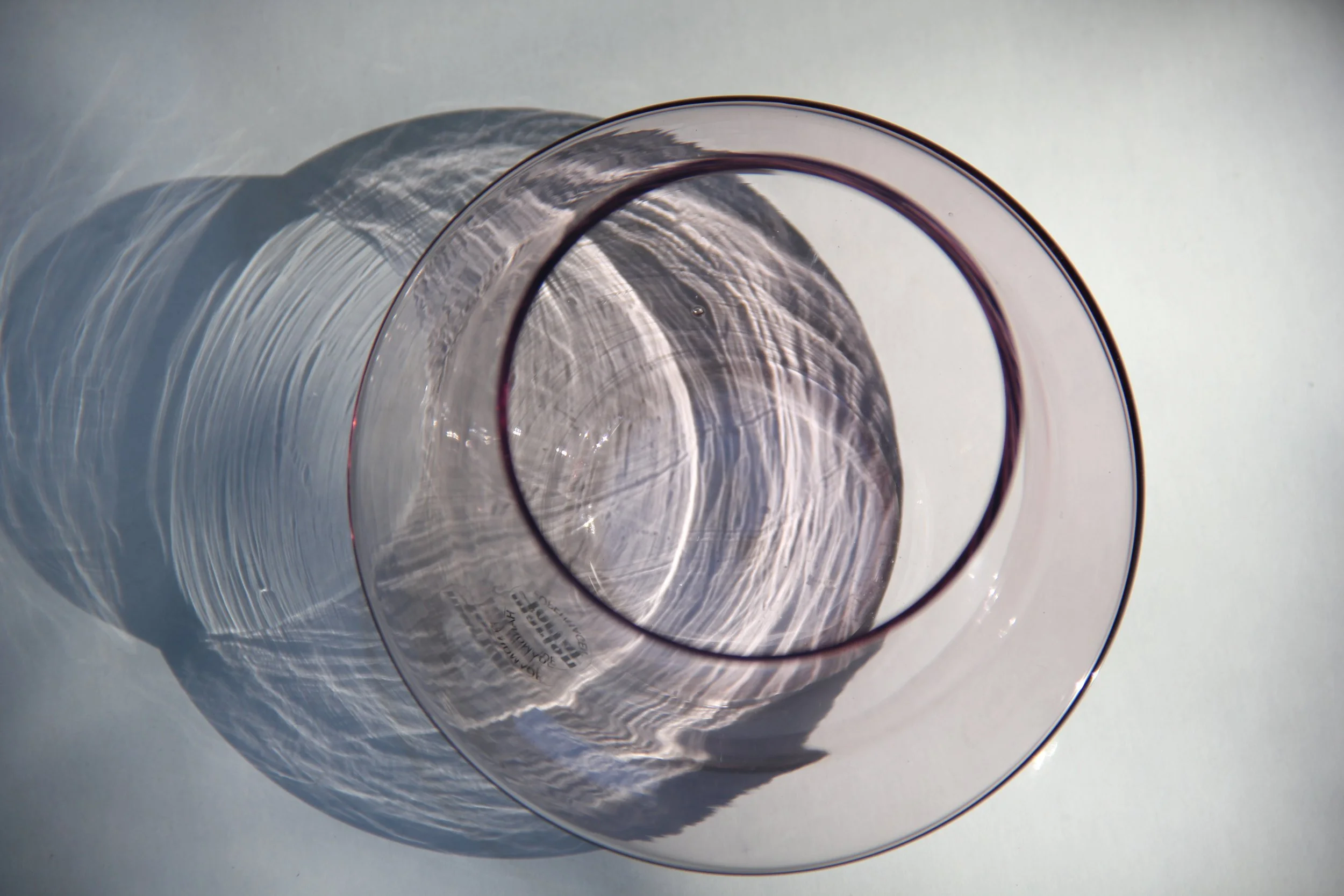 Light filtering through a handmade glass UFO tealight holder
