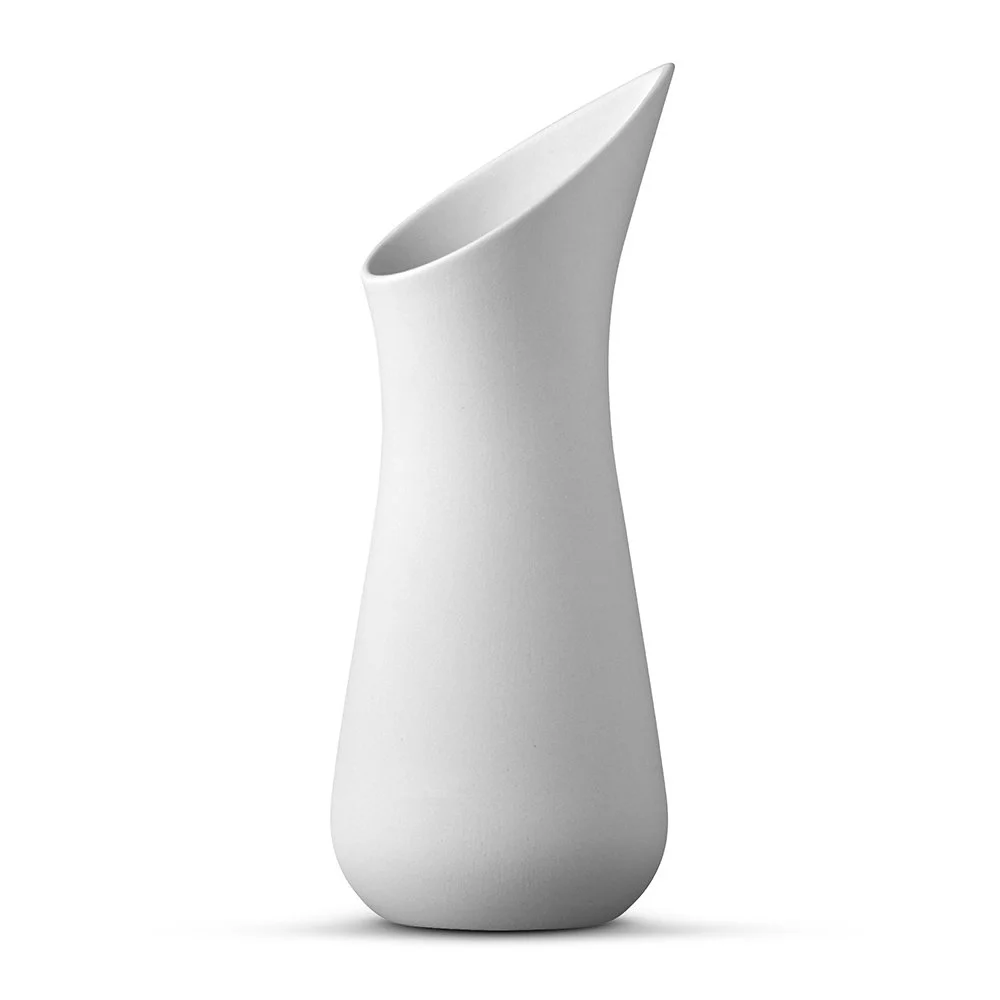 Light grey porcelain carafe by Ditte Fischer Copenhagen with sculptural spout and matte finish.