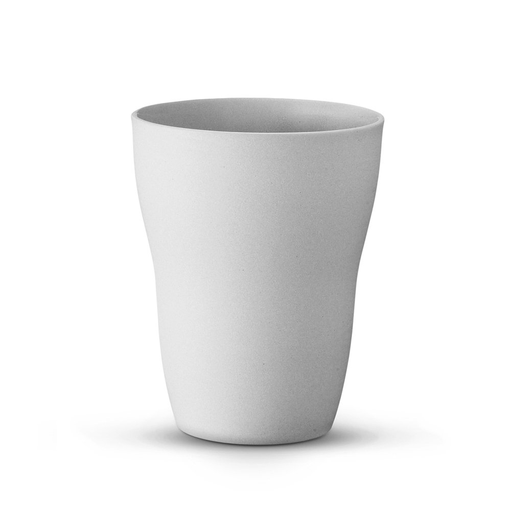 Light grey Scandinavian ceramic tumbler without handle, unglazed exterior and glazed interior, minimalist cylindrical shape