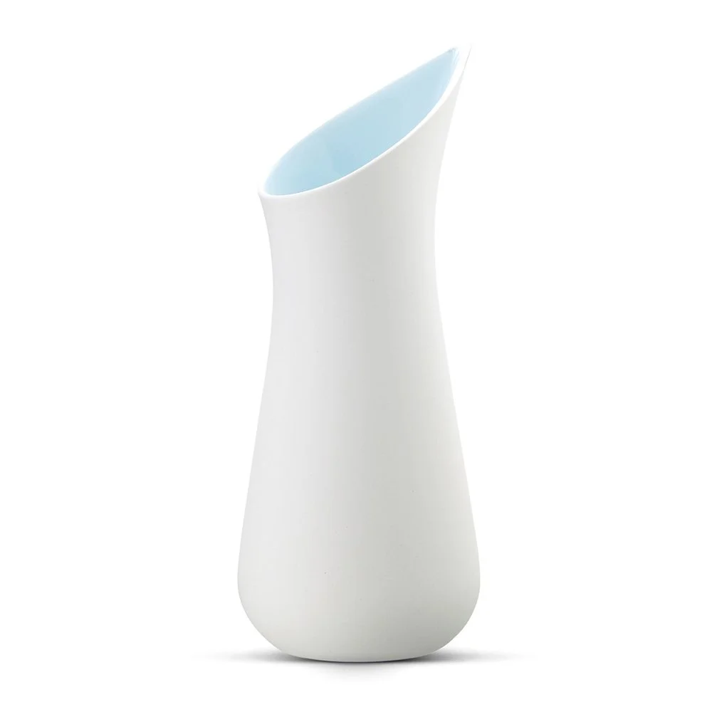 White and ice blue porcelain carafe by Ditte Fischer Copenhagen, featuring a sculptural boat shaped spout and silky matte finish.