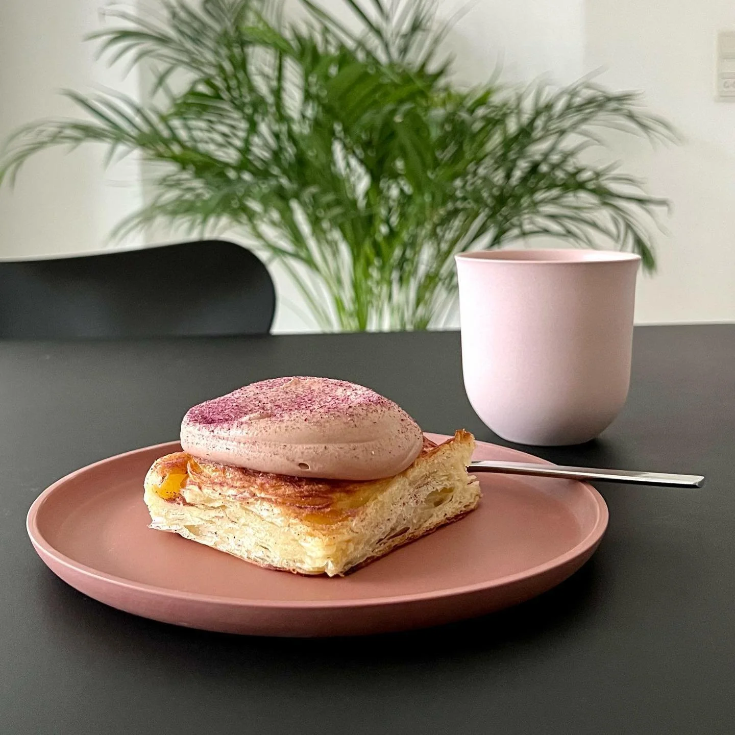 Scandinavian handmade tableware including ceramic cup, bowl, and plate in soft neutral tones