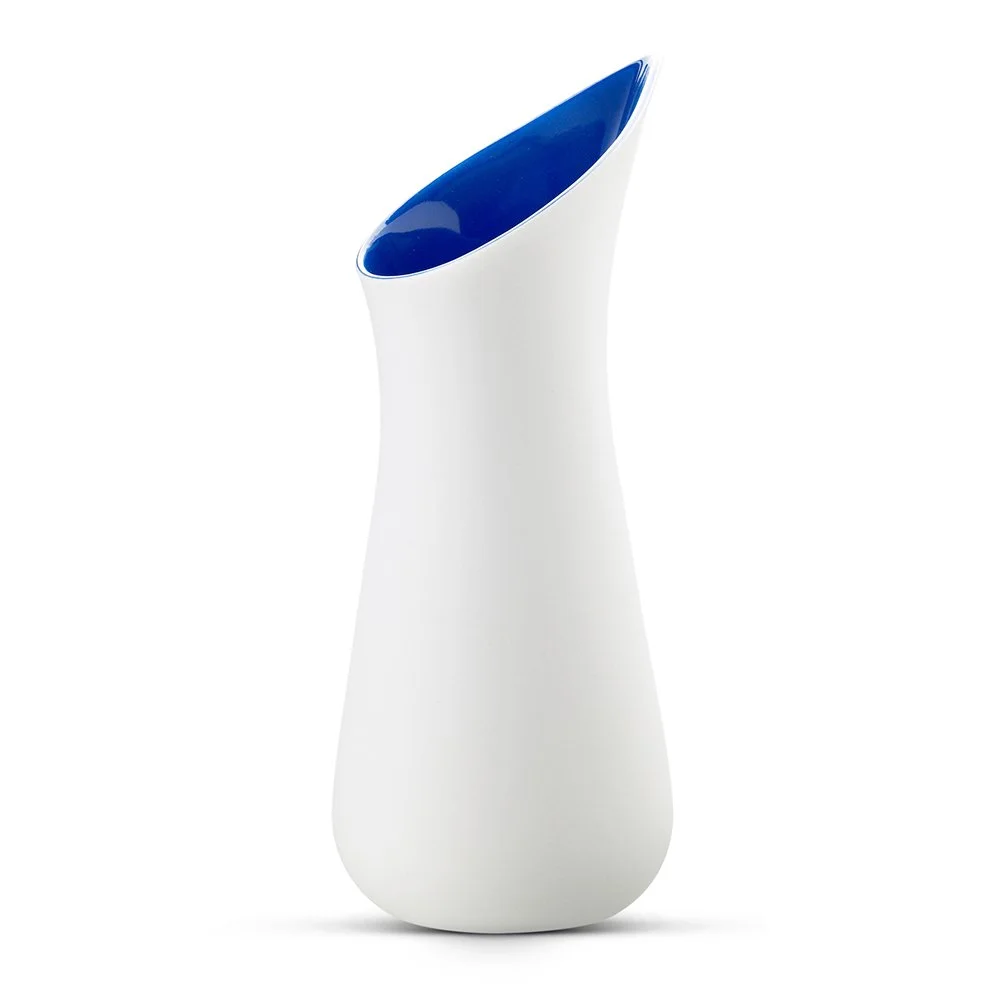 White and blue porcelain carafe by Ditte Fischer Copenhagen, featuring a sculptural boat shaped spout and silky matte finish.
