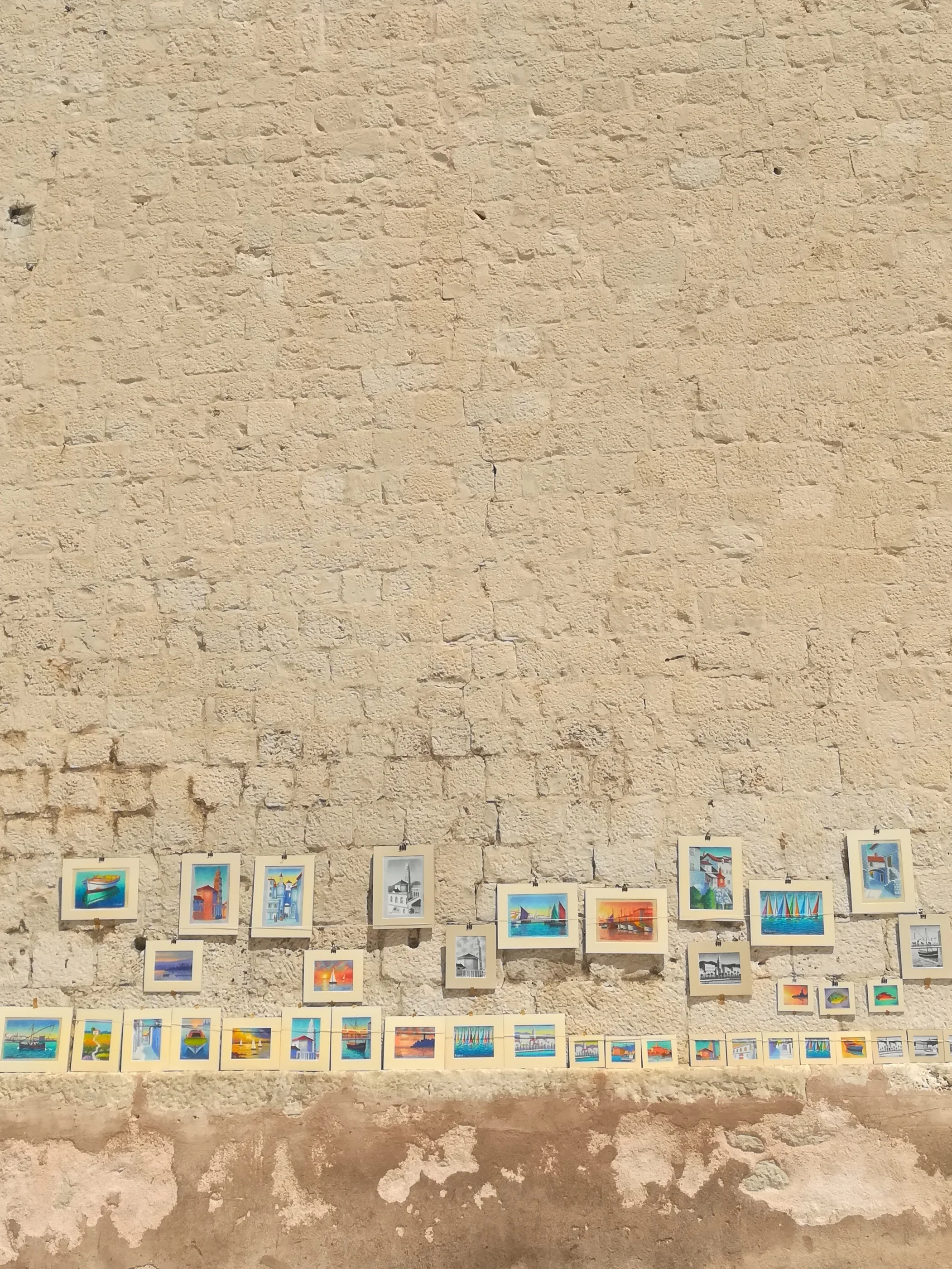 Local artists work against bricks that could tell 1000 stories