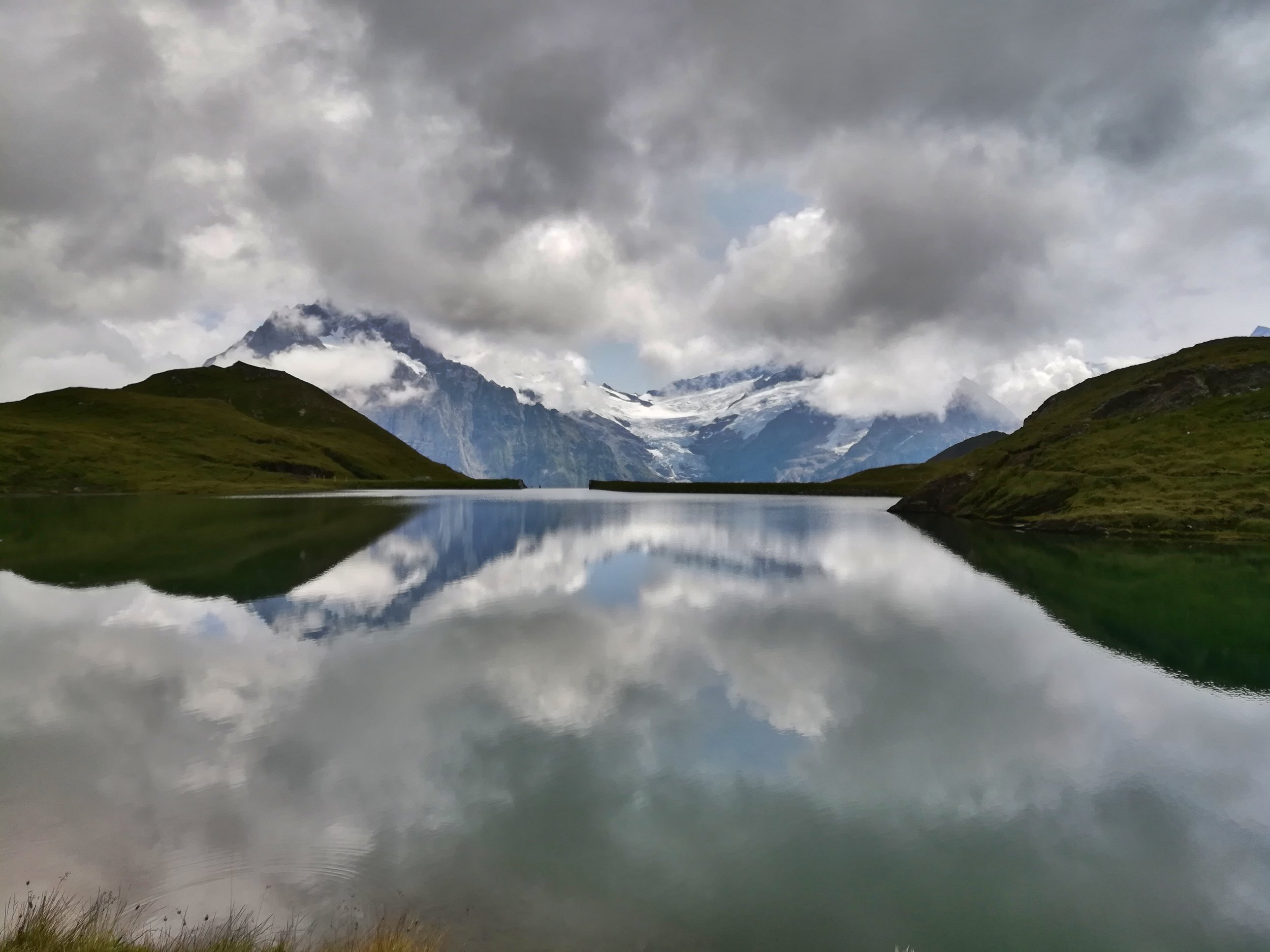 Reflections in a lake on top of the alps