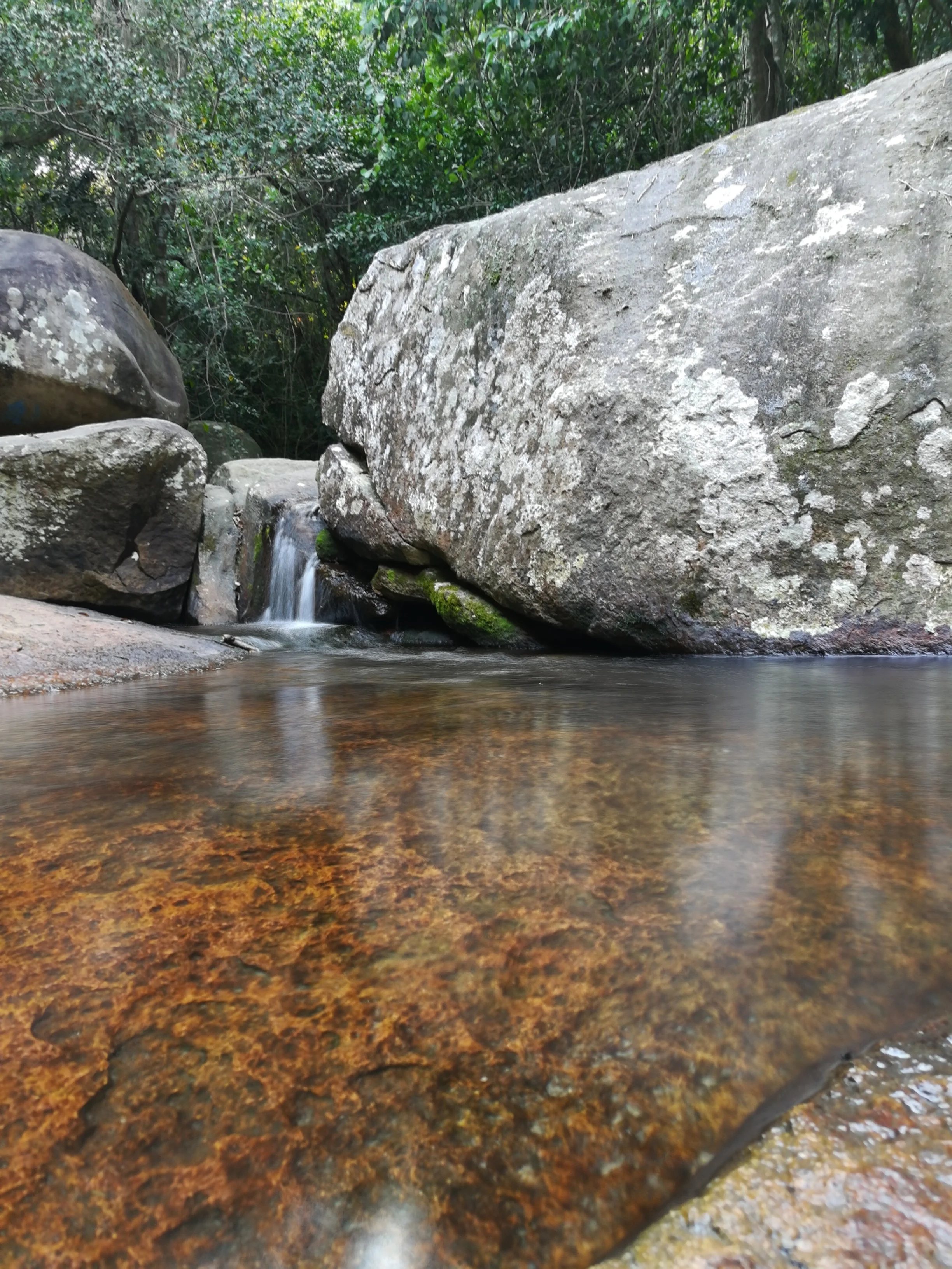 Cute waterfall at the natural rock pool on Ilha Grande 