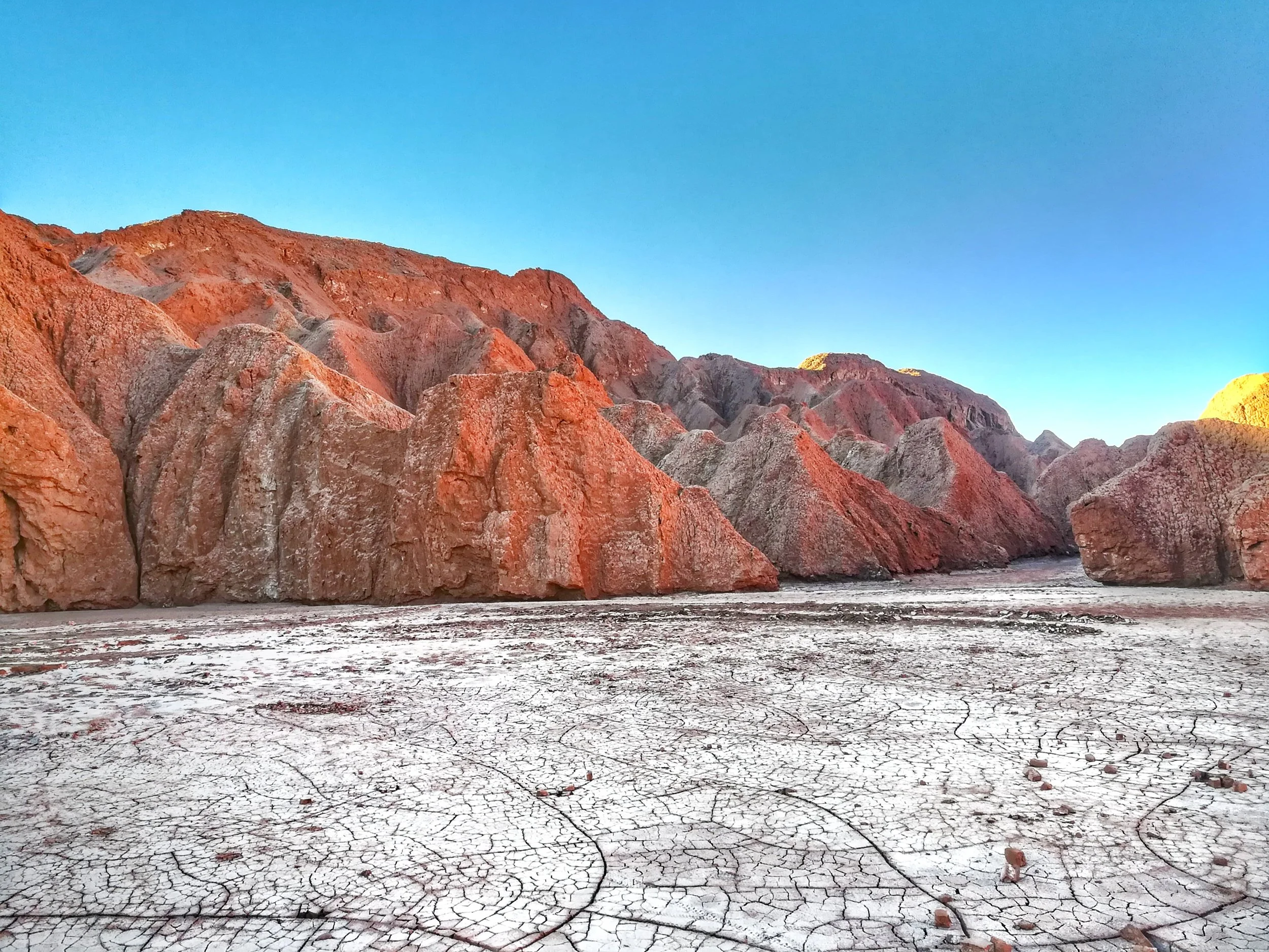Blue skies, red hills, and white salt