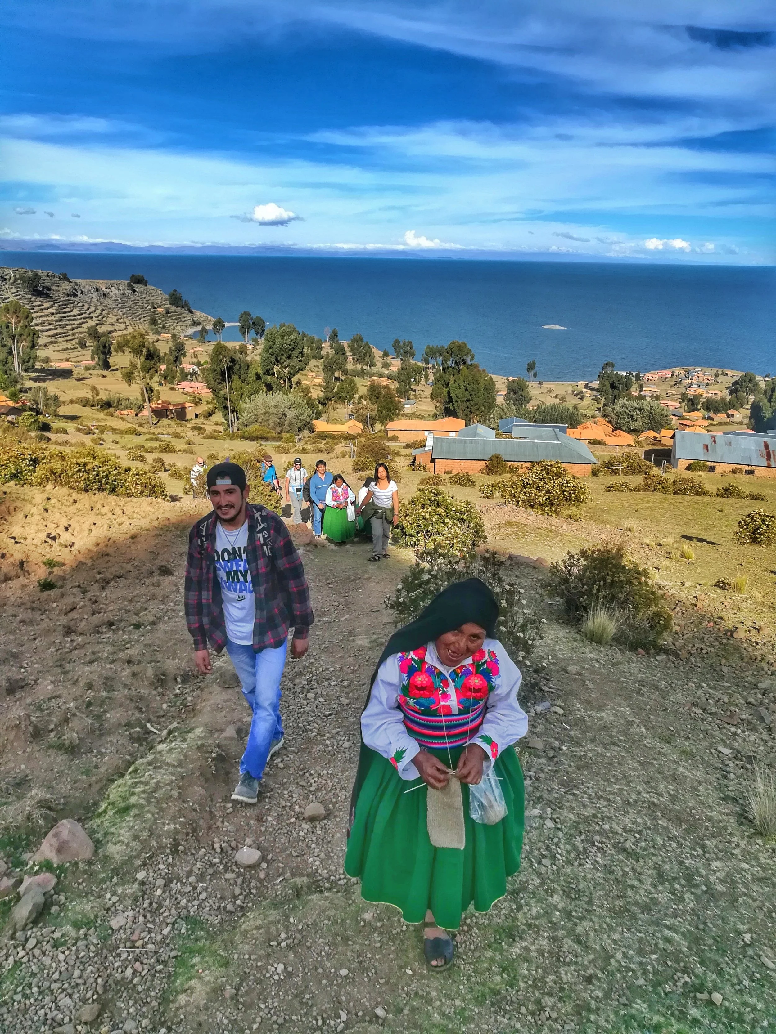 Nearly 4000m above sea level, we're all a little beat, but "mama Epifania" casually knits while taking us up to the top of the hill