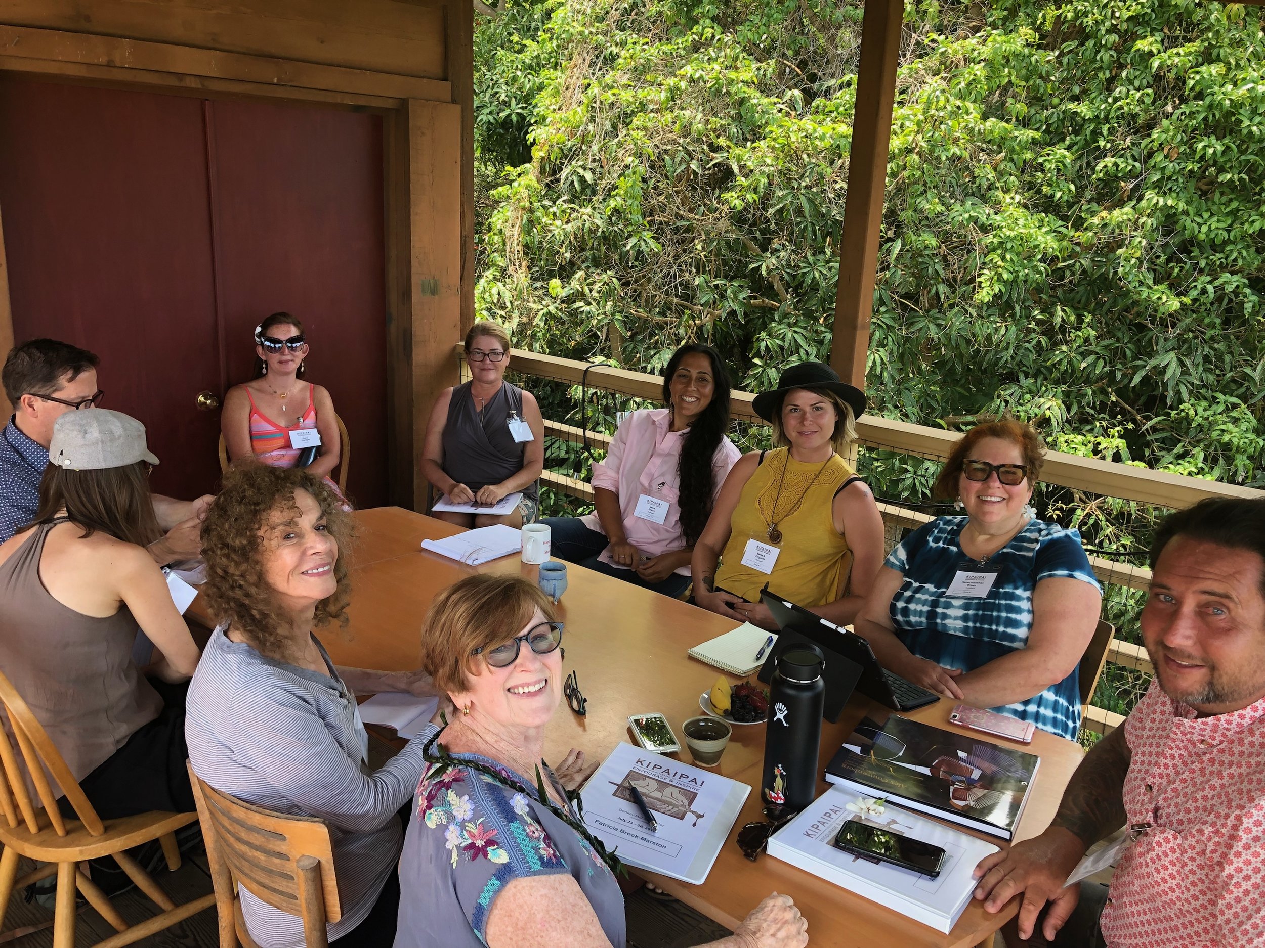 Kipaipai attendees and faculty gather on the deck at Donkey Mill Art Center to learn about Alex Couwenberg's career and how he builds genuine professional relationships.