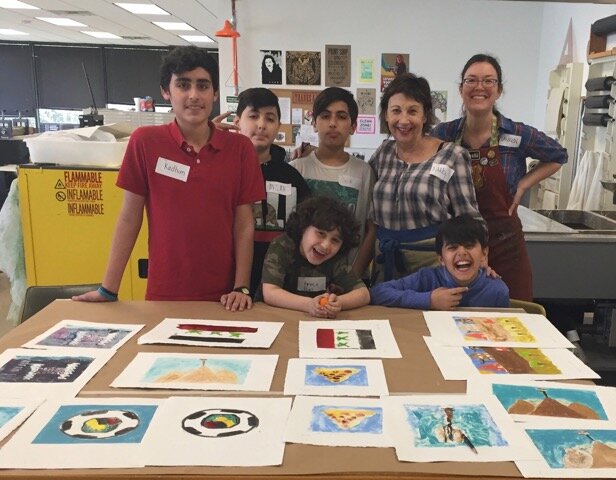Nancy with small groups of local Houston Yazidi women, men, and children and their monotypes