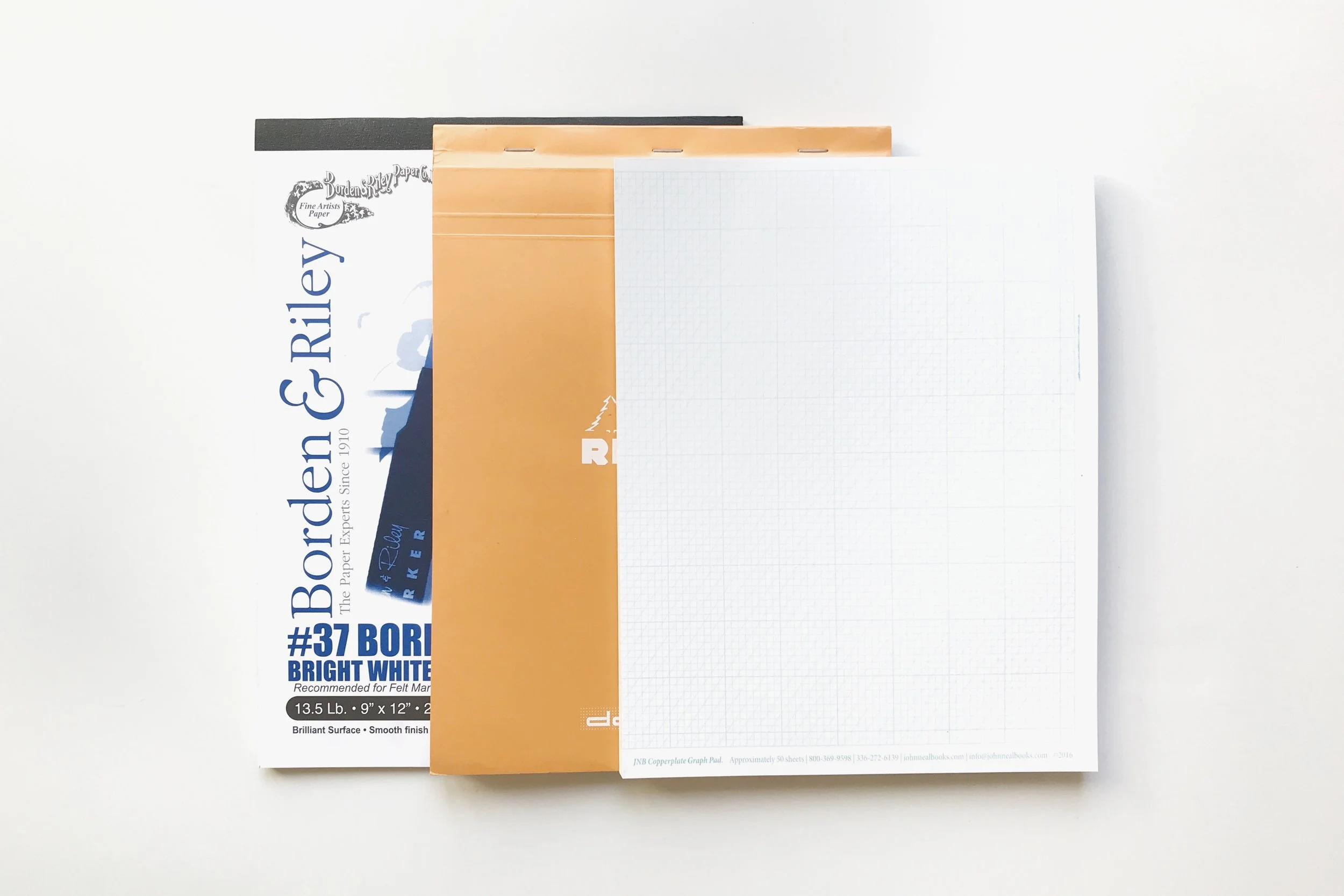 Paper Recommendations for Beginner Calligraphers (from left to right): Borden & Riley #37 Layout Paper , Rhodia Dot Paper , John Neal Books Copperplate Pad