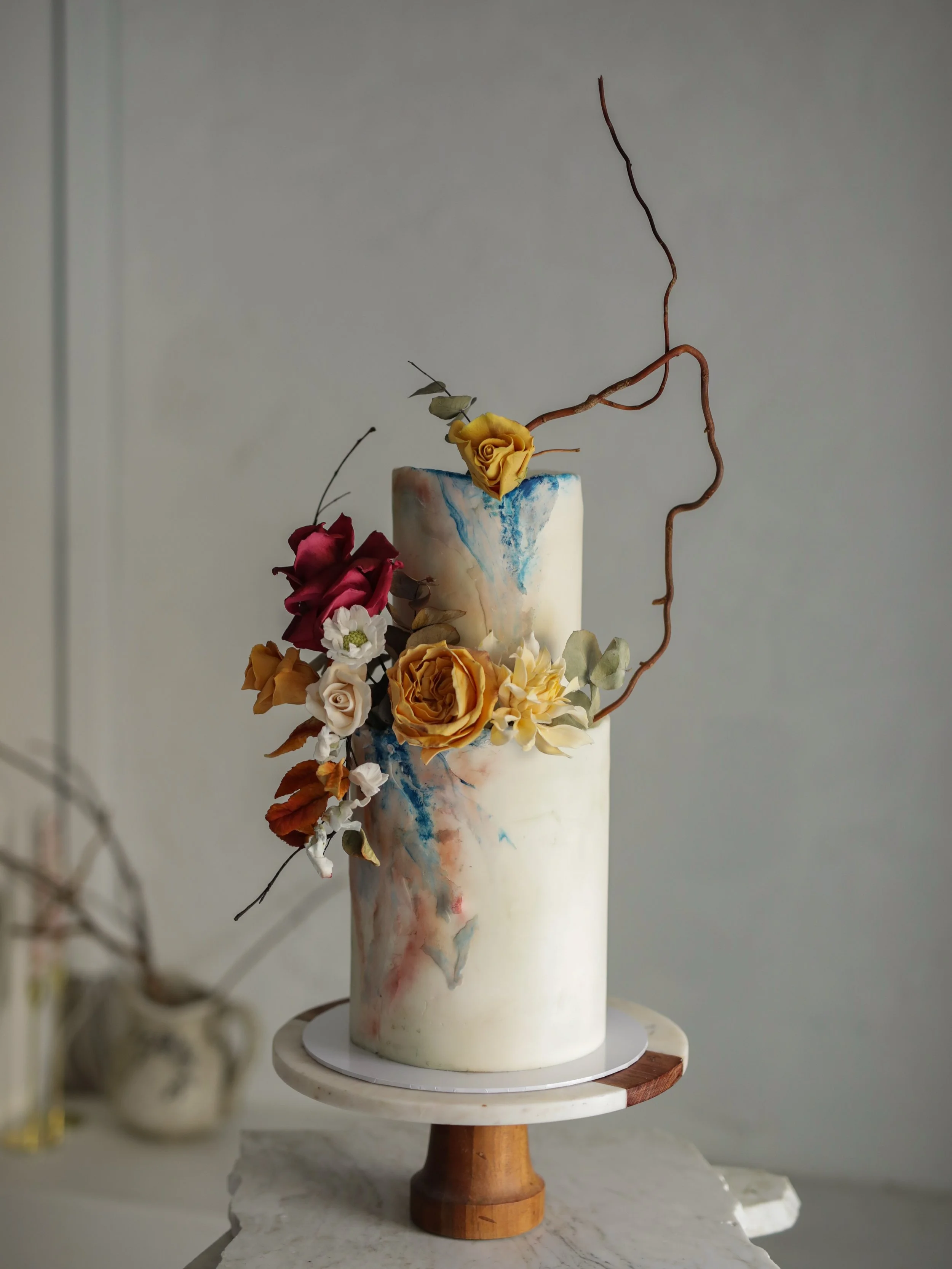 2 of 2 wedding cakes delivered to the ever so dreamy @markreecastlesligo ✨

The design features delicate hand-painted details in soft blue and blush tones. Cascading handcrafted sugar flowers in rich burgundy, burnt orange, golden ochre and creamy iv