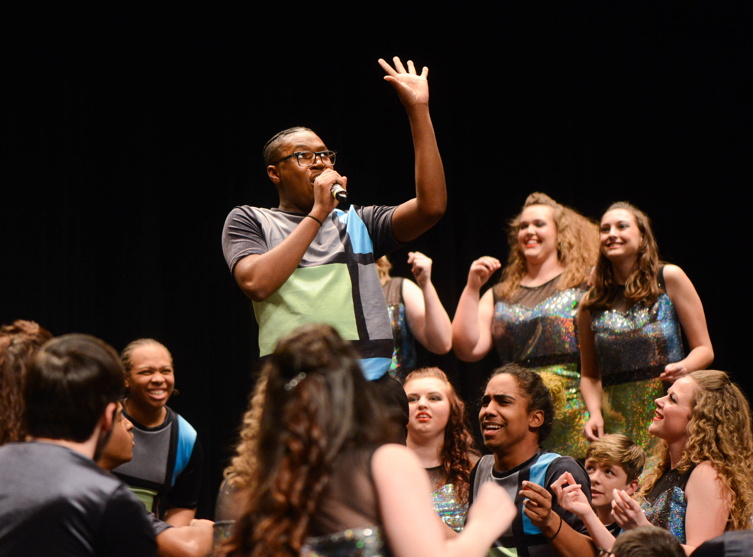  Battle junior Jermon Lambert sings a solo during the benefit concert on Thursday at Rock Bridge High School. Battle High School and Rock Bridge came together to raise money for Children's Grove.&nbsp; 