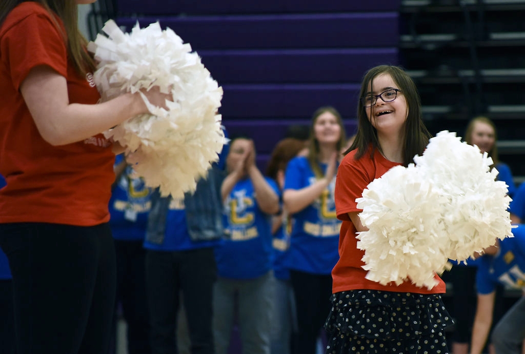  Julianna Basi smiles after completing a cheer routine Thursday during the United Challenge at Hickman High School. United Challenge is an annual competition for students with special needs in ninth through 12th grade in high schools across the distr