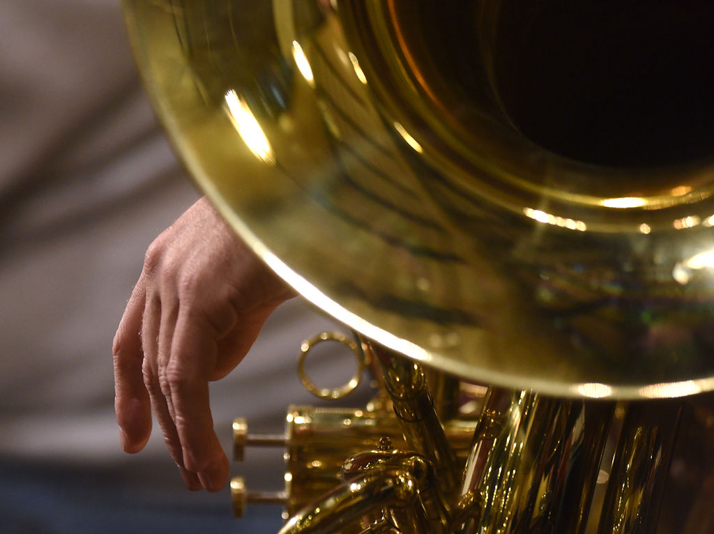  A member of the Columbia Community Band rests against their instrument before rehearsal Wednesday at the Missouri United Methodist Church. The band’s concert this weekend will feature music by Missouri composers.      