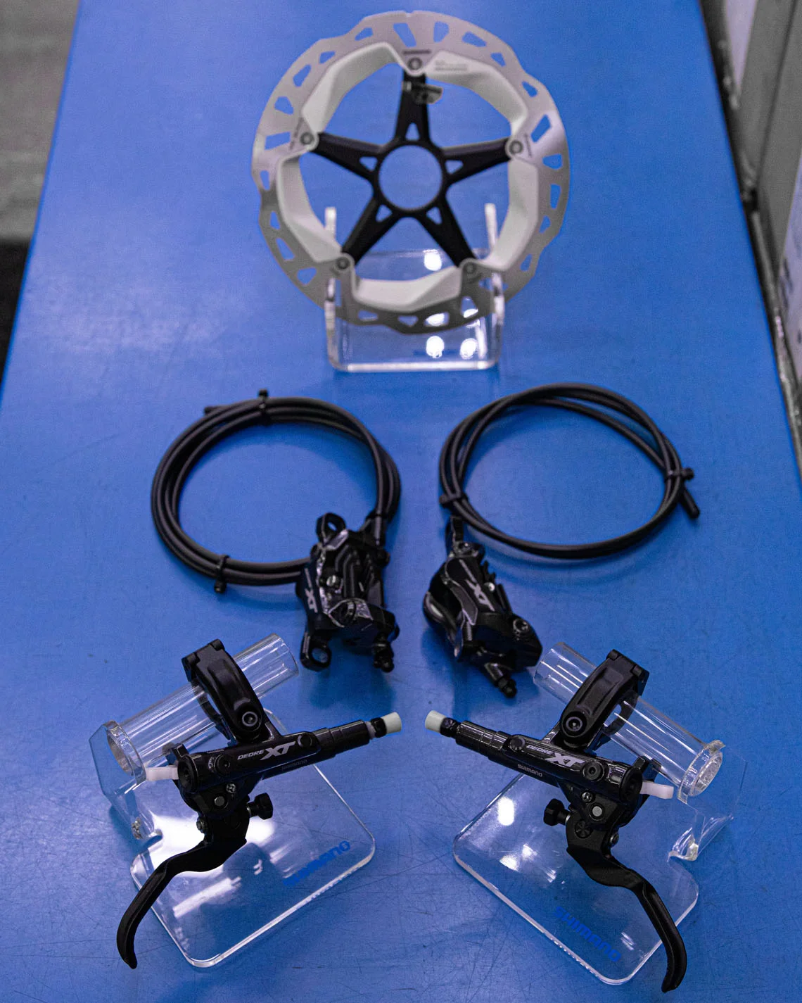 Brakes The Brakes have received a re-designed master cylinder. The Brake’s main body and end now firmly rests on the bar which improves the firmness and stiffness of the brakes. The Free Stroke Adjuster is still present and the lever design is the same for both the 4 Port and 2 Port versions of the brakes. Rotors have been redesigned with cooling fins.
