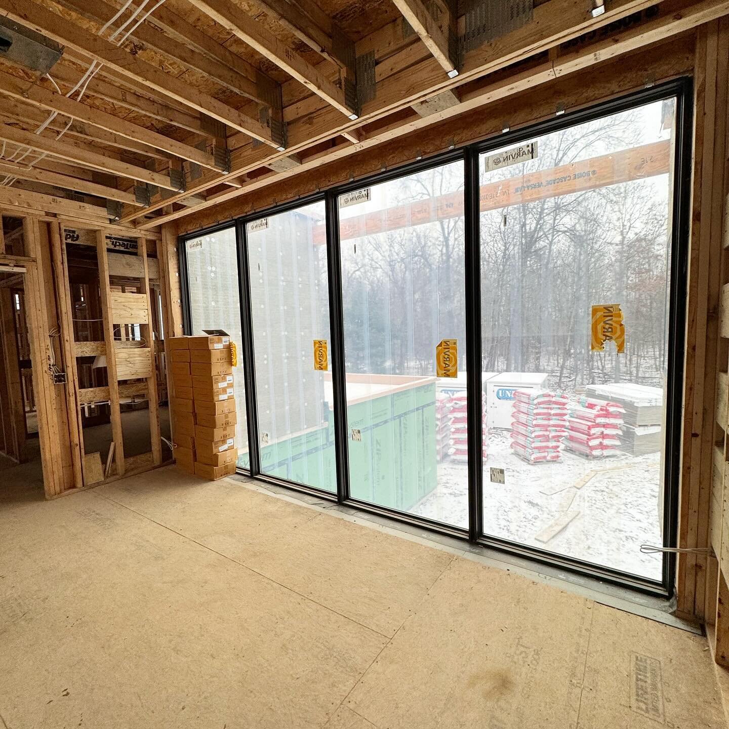 Talk about office views. 

A built-in white oak desk will truncate this view, minimally. But these east facing windows will flood this space with natural light above the foyer of this custom modern home. 

Thrilled to be nearing the end of mechanical