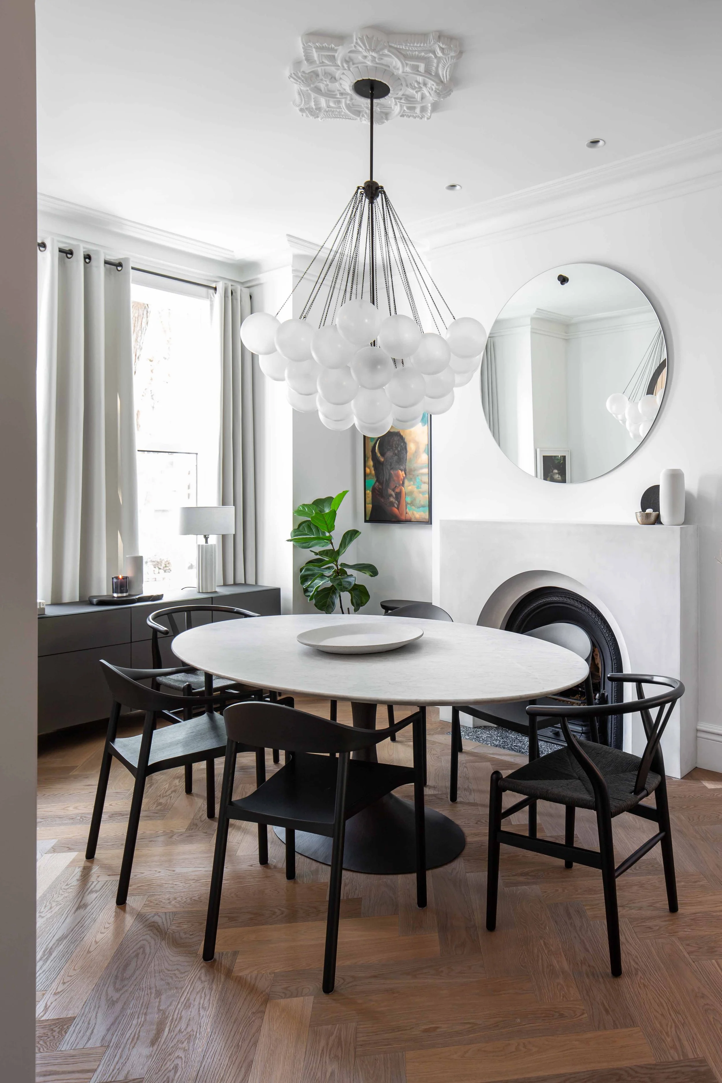 Victorian dining room restoration featuring concrete fireplace mantle and plaster cornices