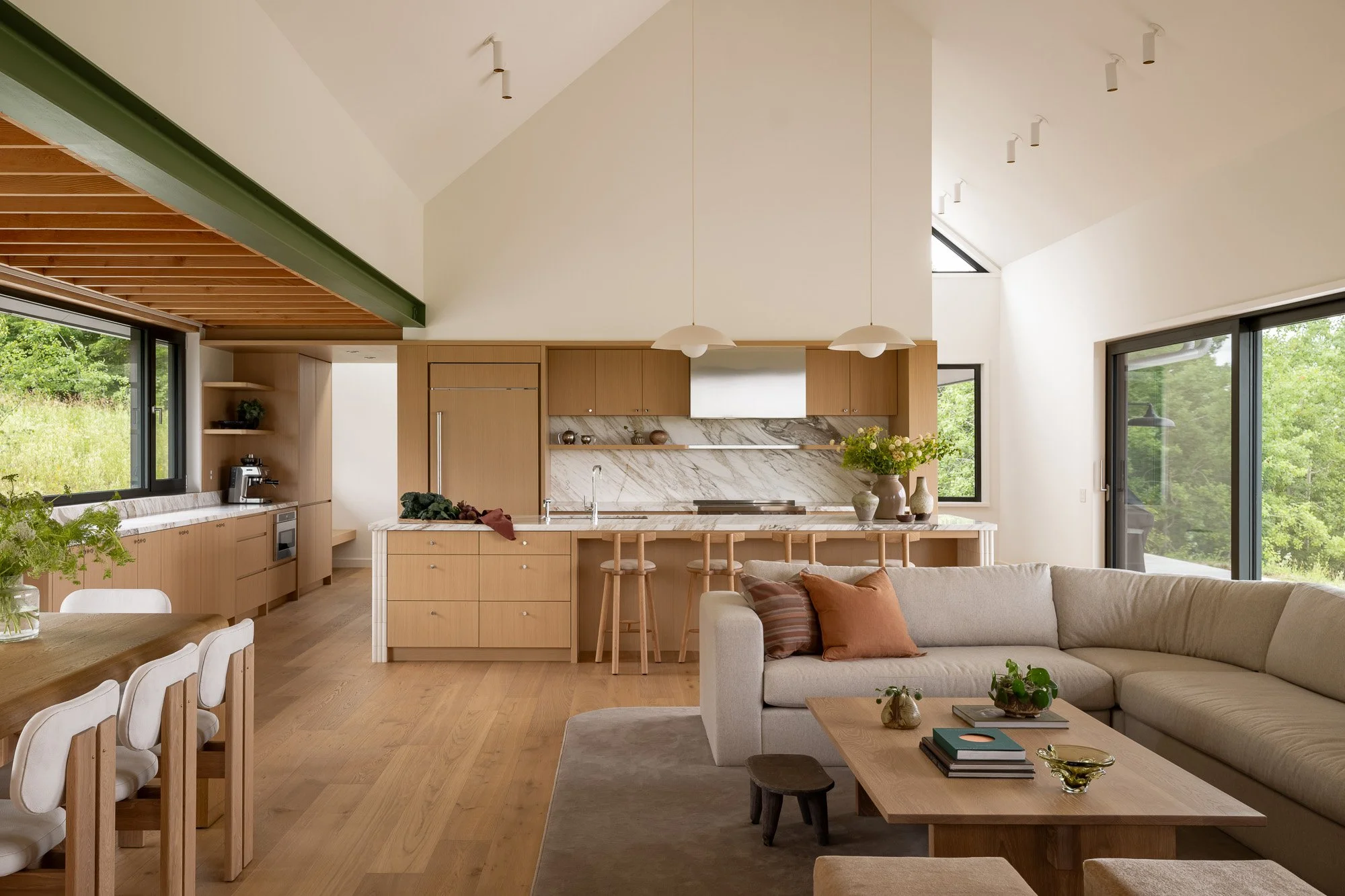Spacious custom kitchen layout featuring high vaulted Douglas fir ceilings and premium integrated architectural details.