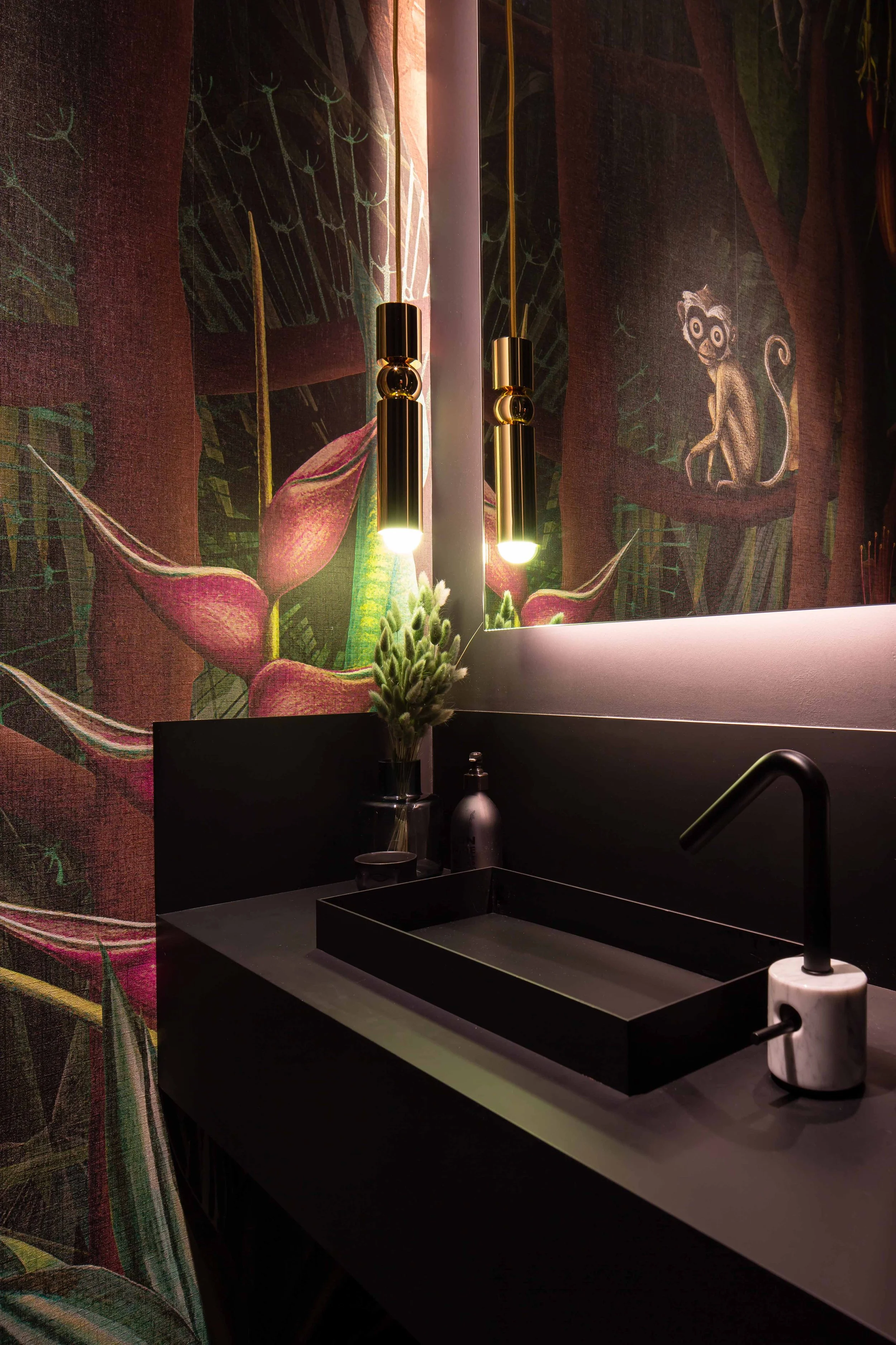Moody powder room hidden behind custom millwork paneling with dark wallpaper