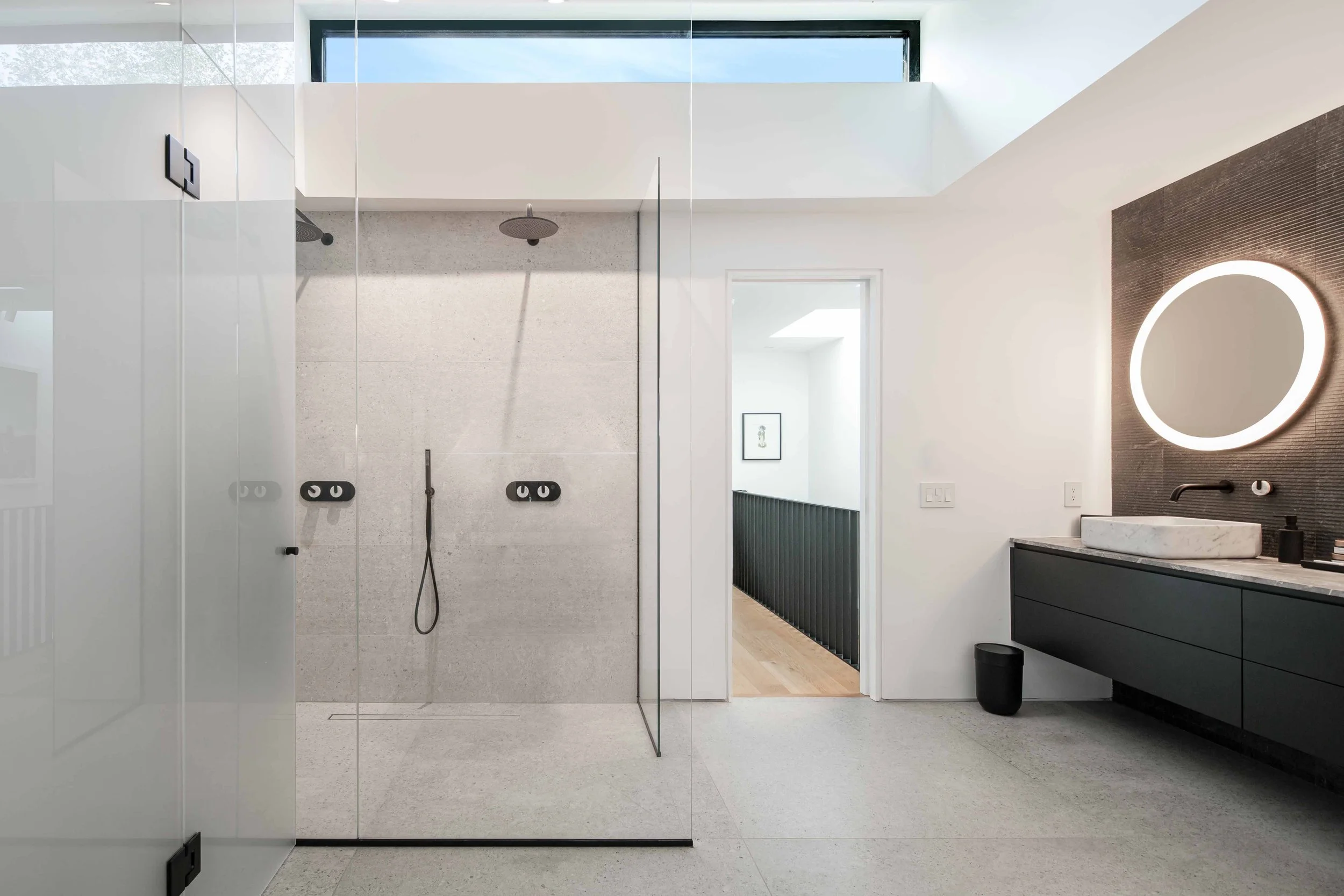Luxury modern primary bathroom with freestanding tub and custom painted millwork
