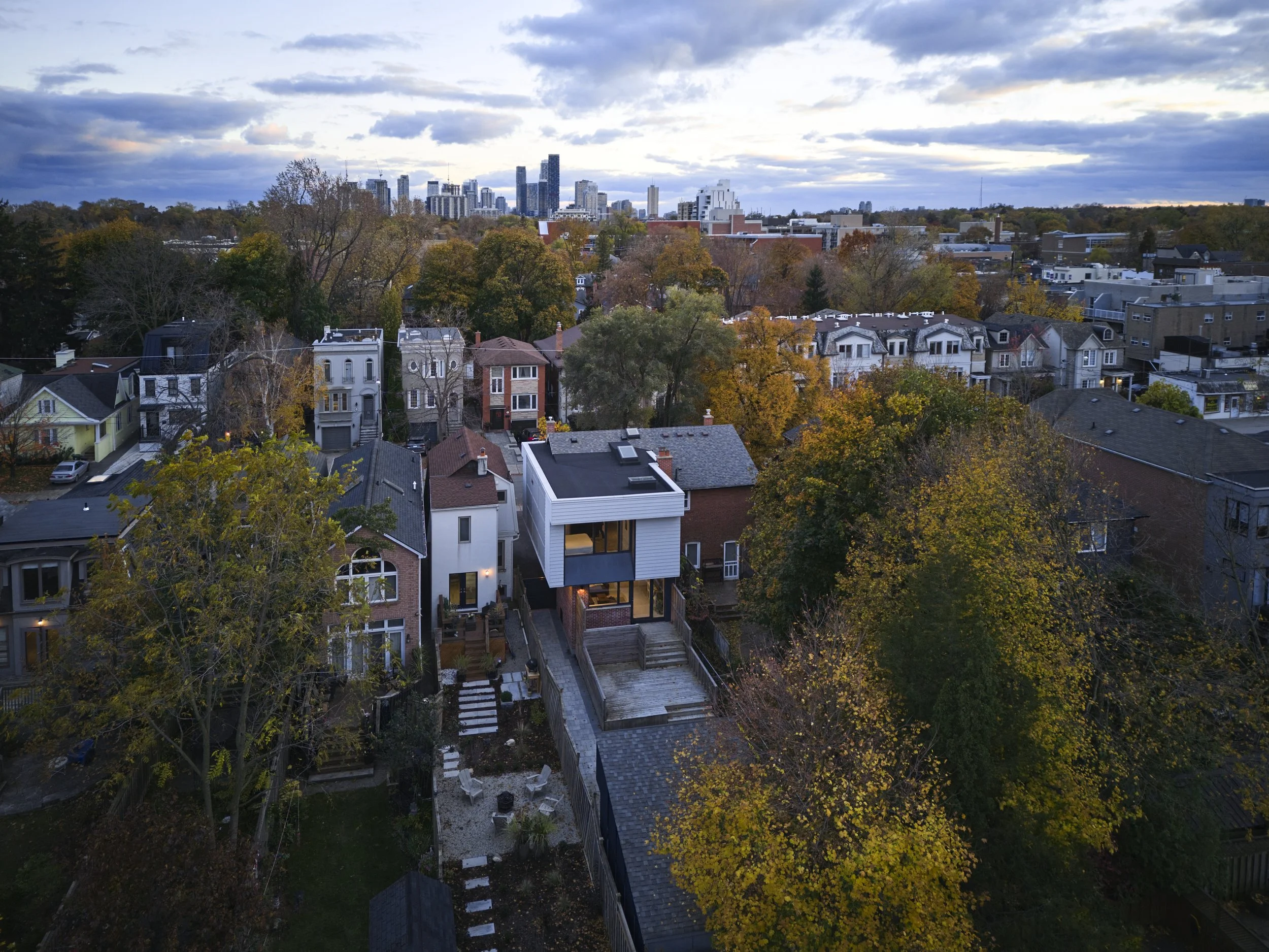 Aerial view of a semi-detached house renovation and vertical addition project in midtown Toronto.