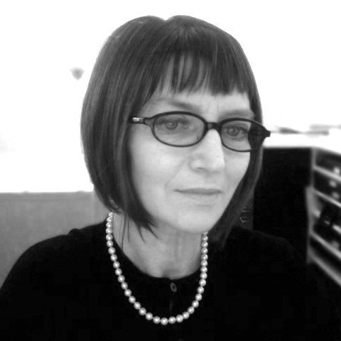 A black and white headshot of Debra Klomp Ching. ©Debra Klomp Ching.