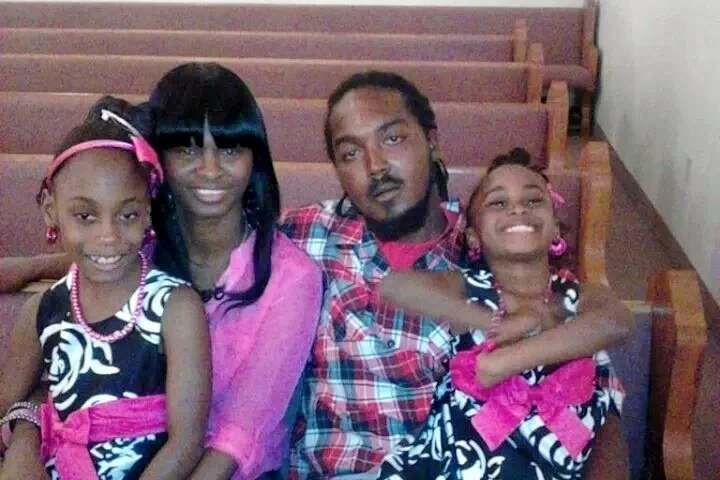 Gregory Vaughn Hill Jr. and Monique Davis, with their daughters Destiny (left), and Aryanna (right).