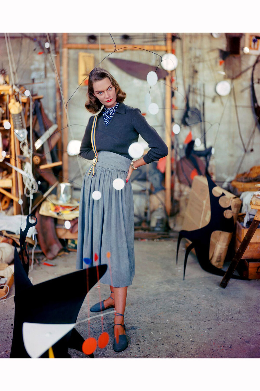 a-woman-models-a-gray-suede-skirt-in-the-studio-of-artist-alexander-calder-strolling-among-his-mobiles-1948.jpg