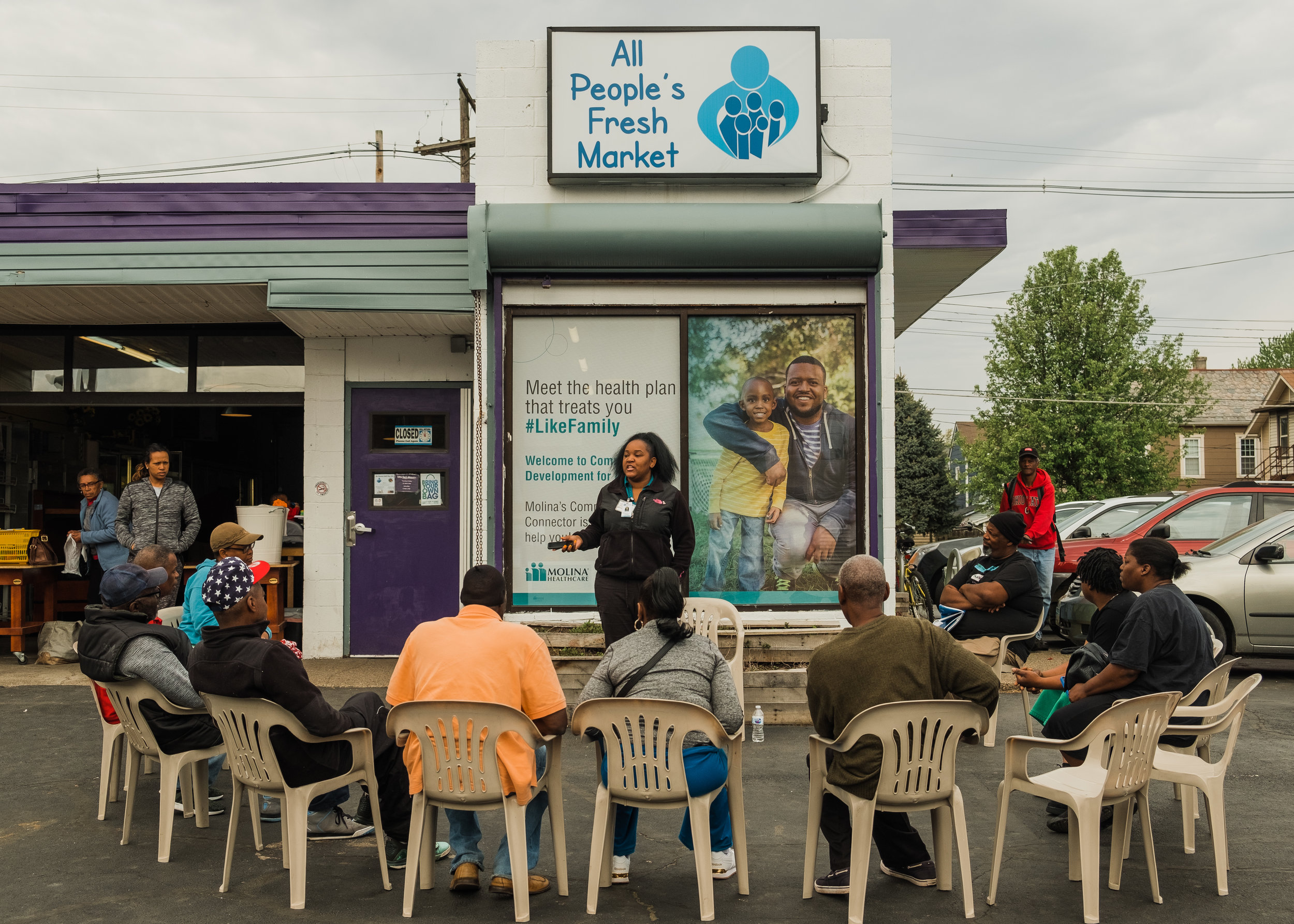  It is 10:30am, a half an hour before the market opens its doors and customers who are eager to get the best pickings of produce sit in a semi-circle listening to a woman who preaches about the health benefits of engaging in healthy living and eating